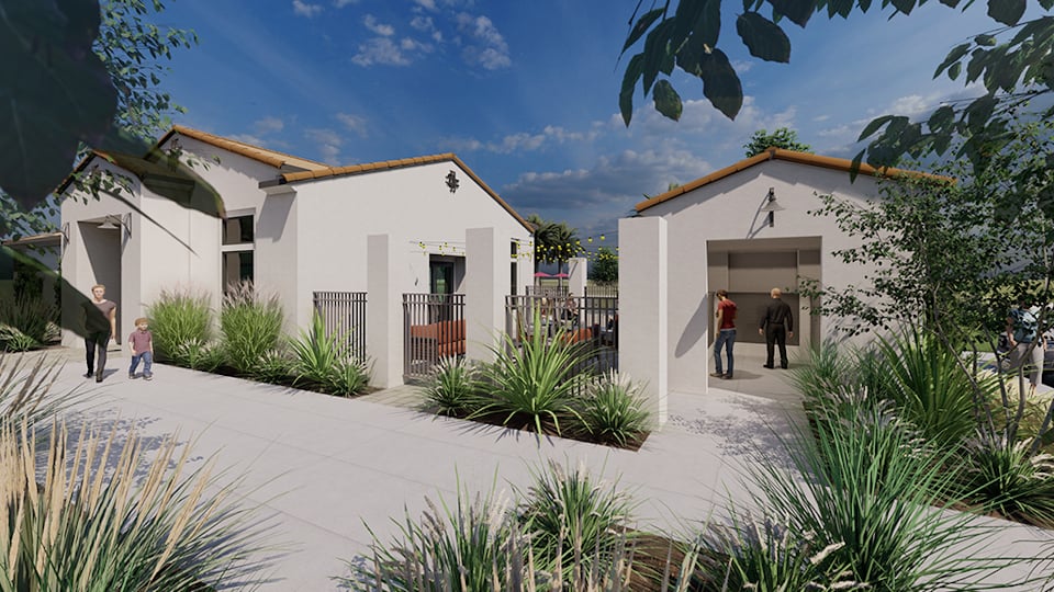 A group of people walking outside of a building.