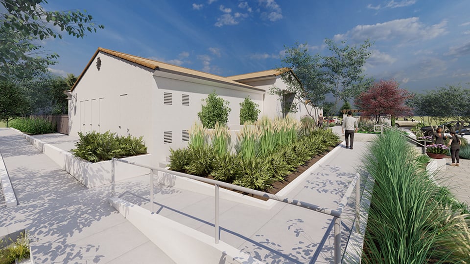 A white house with a white fence.