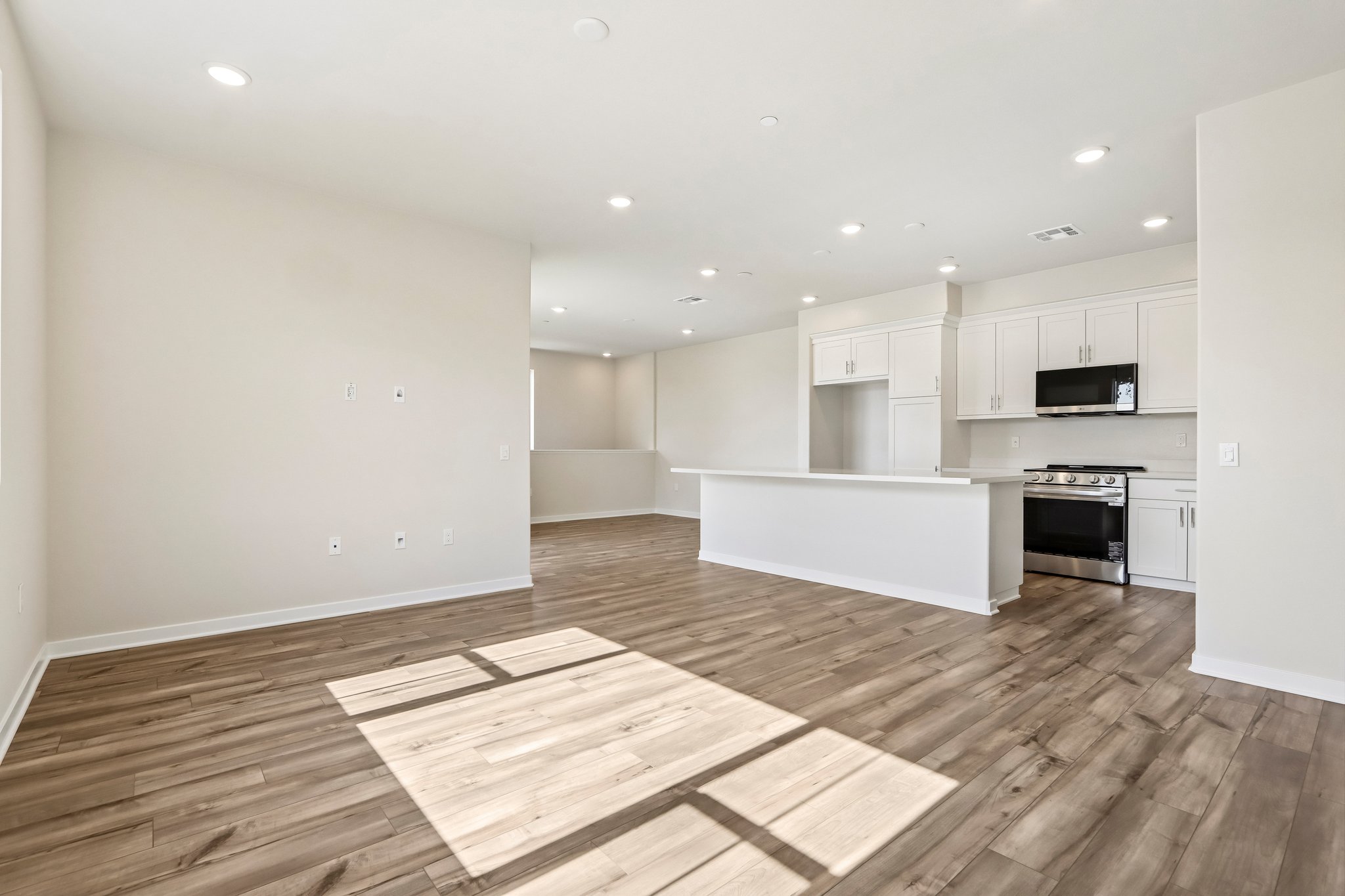 A large kitchen with white cabinets.