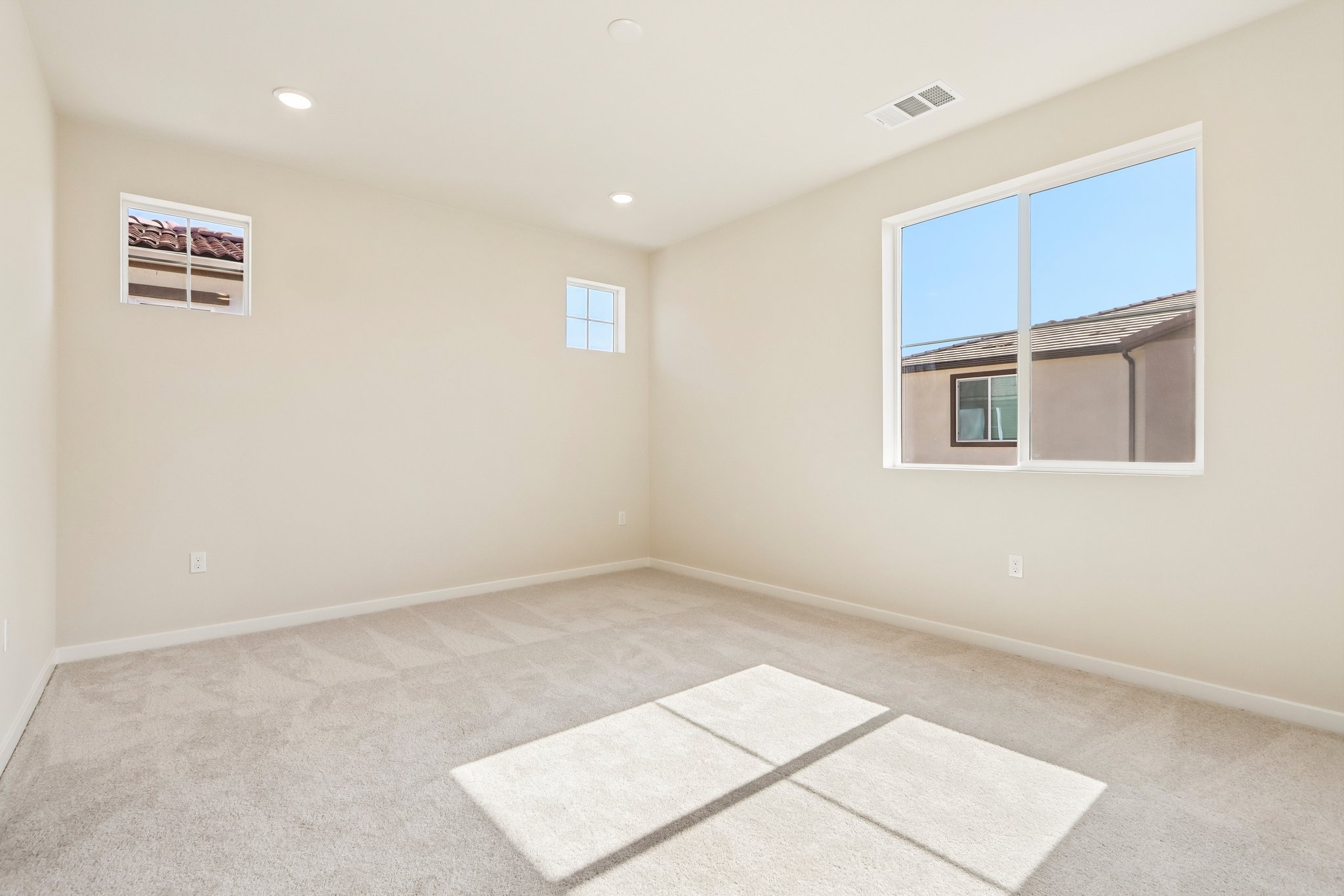A room with a tile floor and windows.