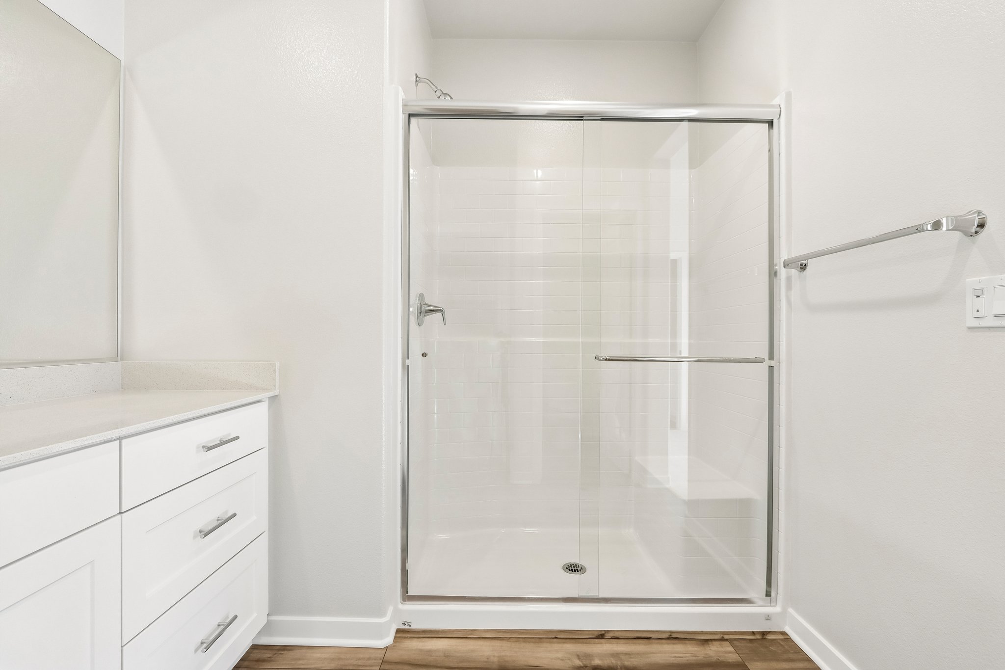 A shower unit in a bathroom.