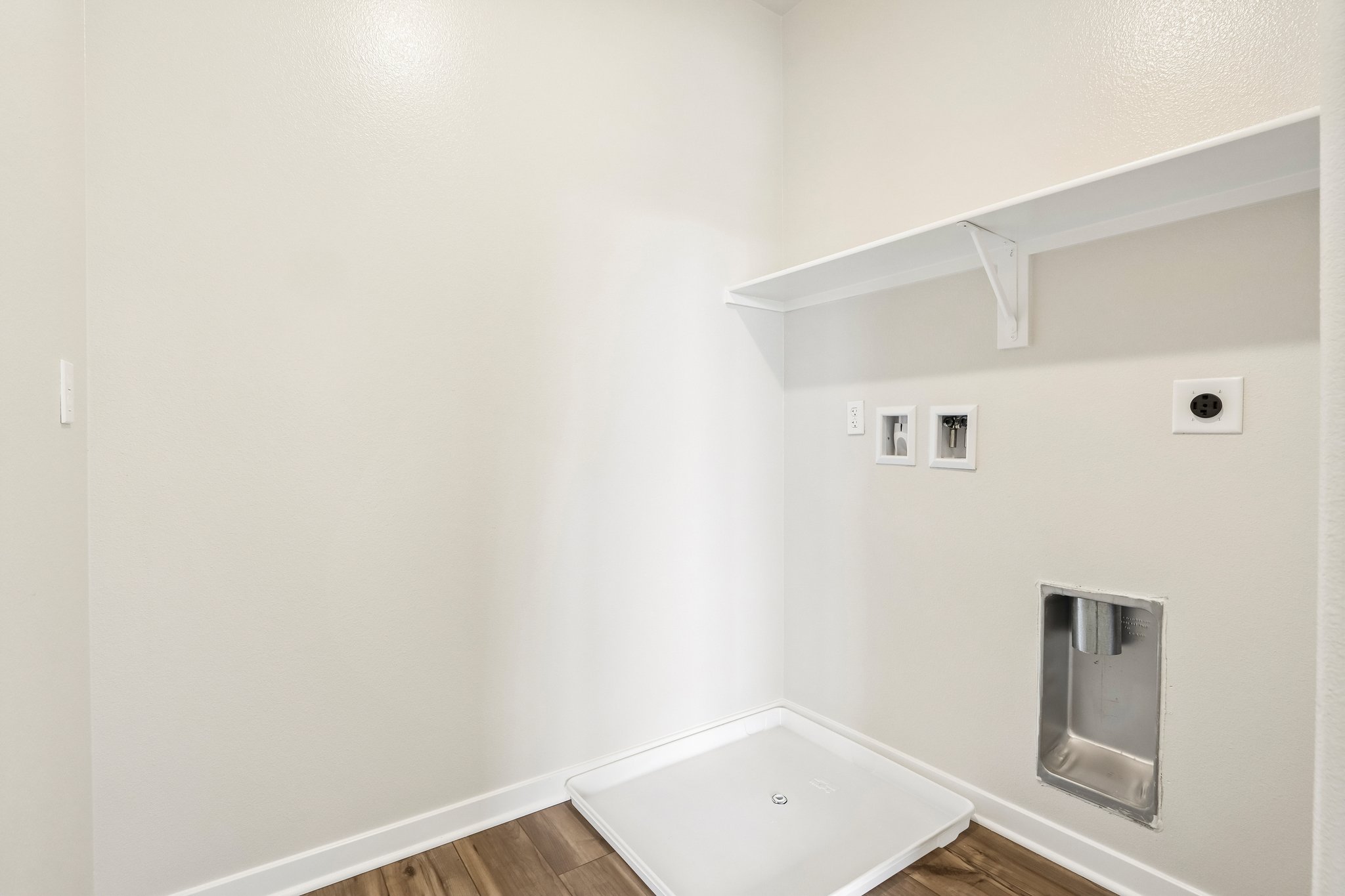 A white bathroom with a sink.