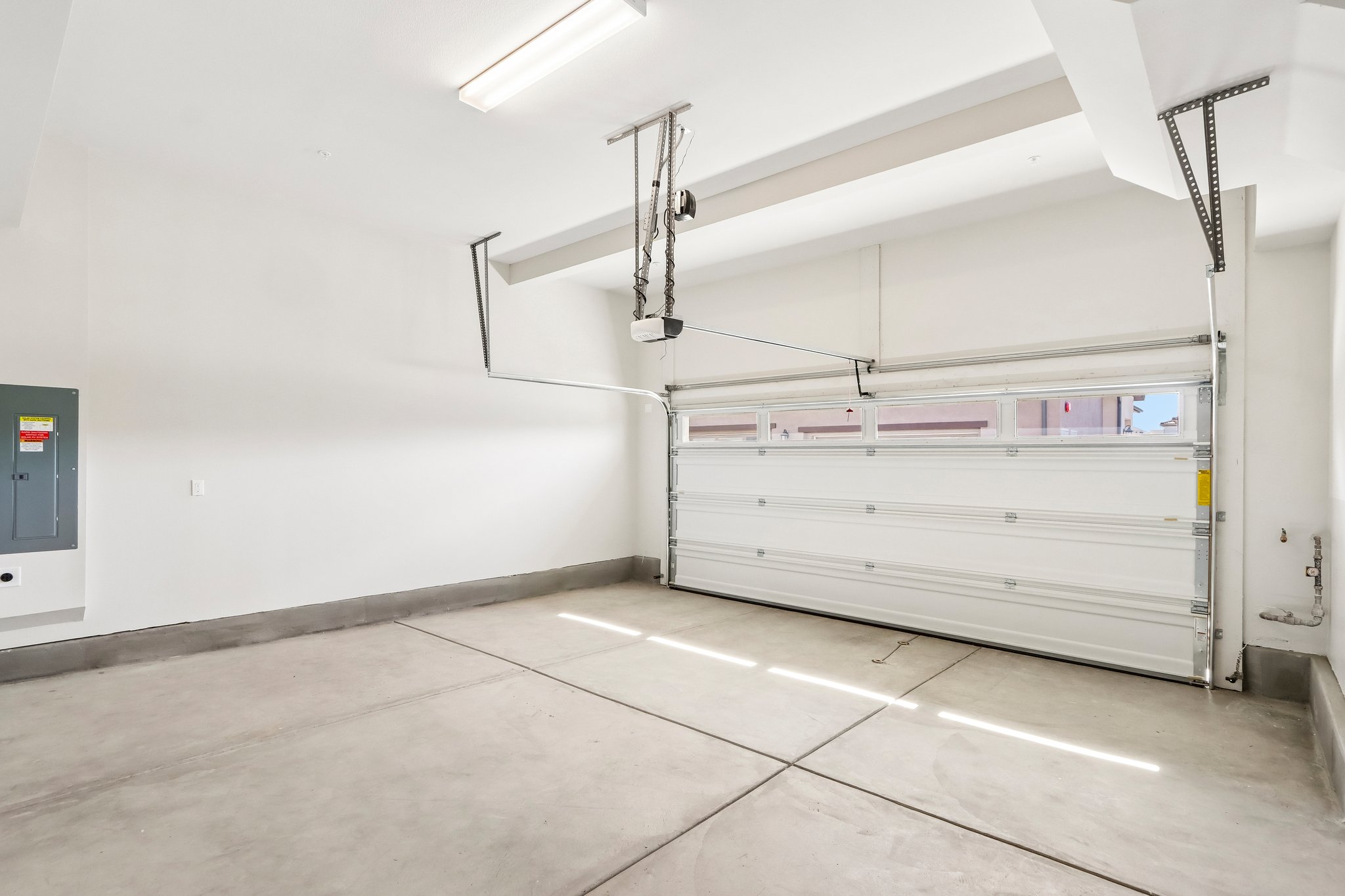 A large white room with a large metal object in it.