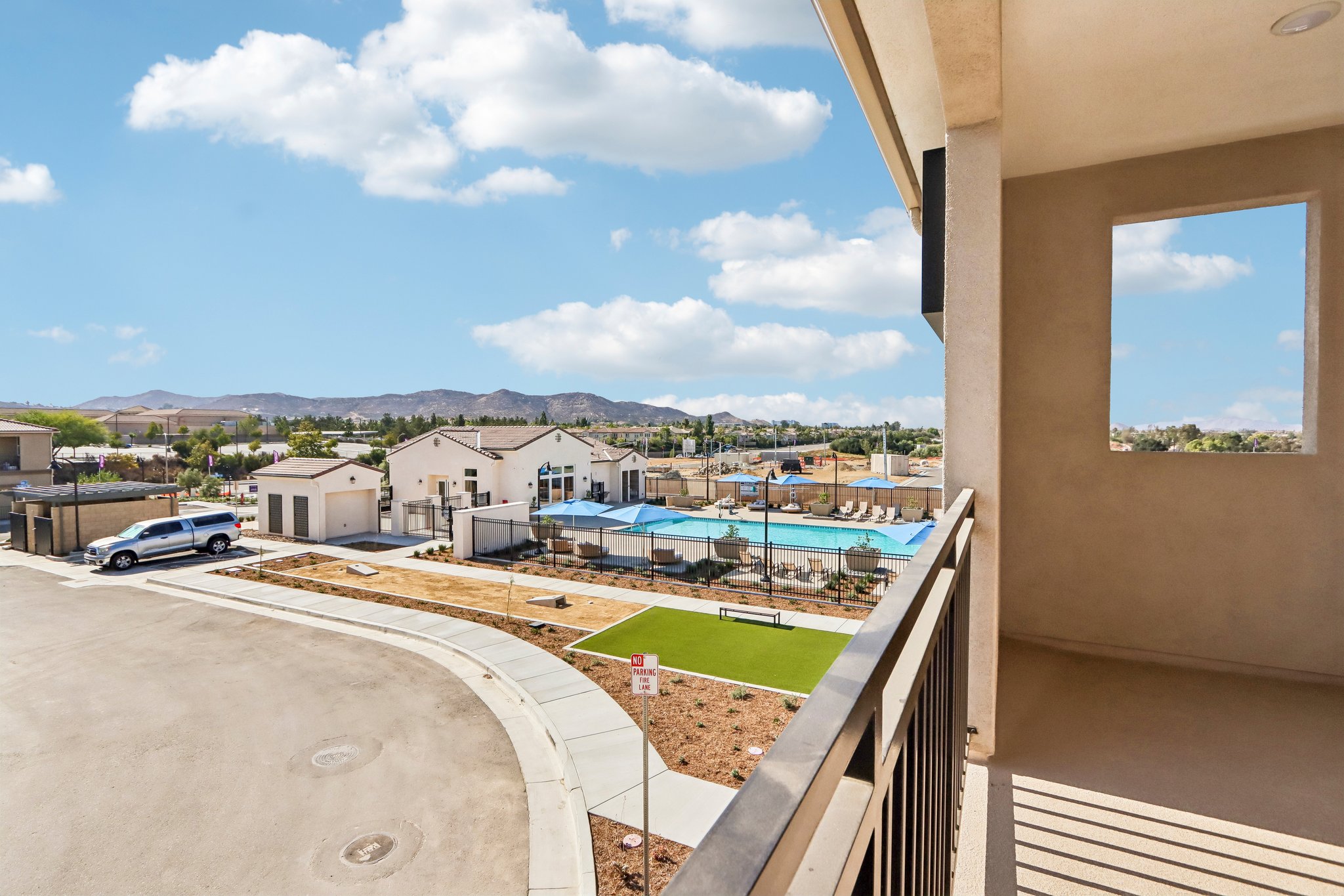 A view of a town from a balcony.