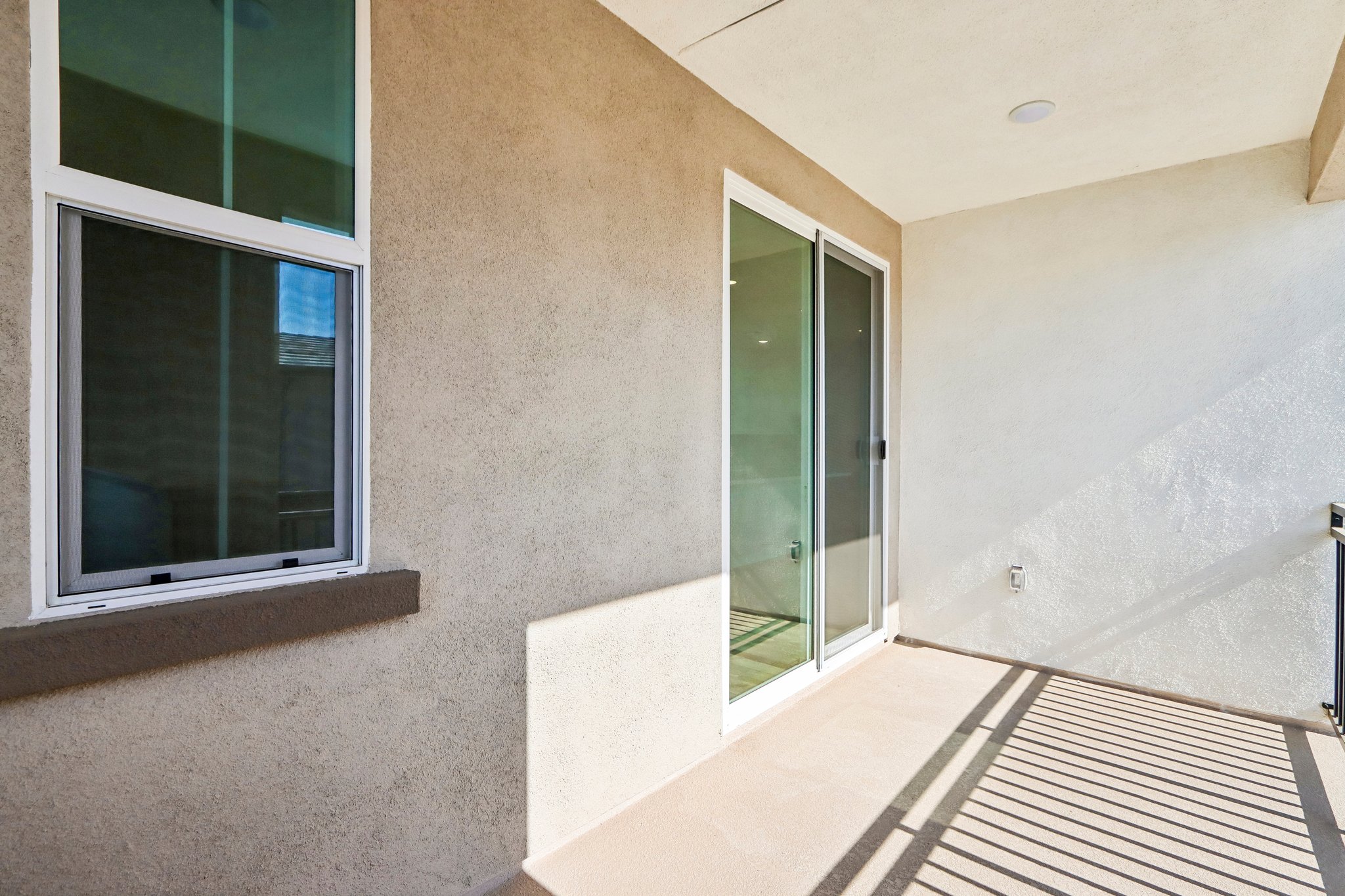 A room with windows and a door.
