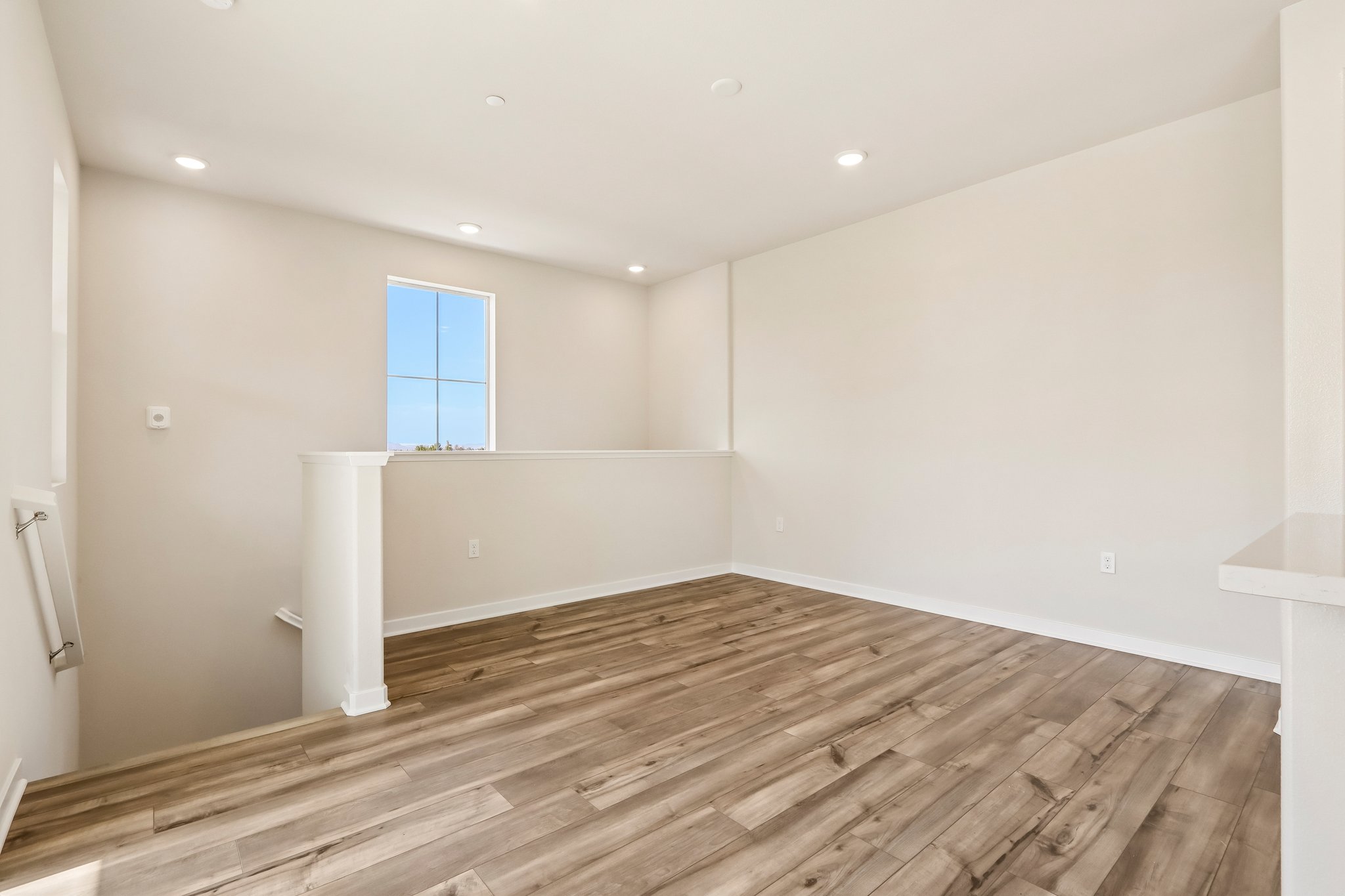 A room with a wood floor and a wood floor.