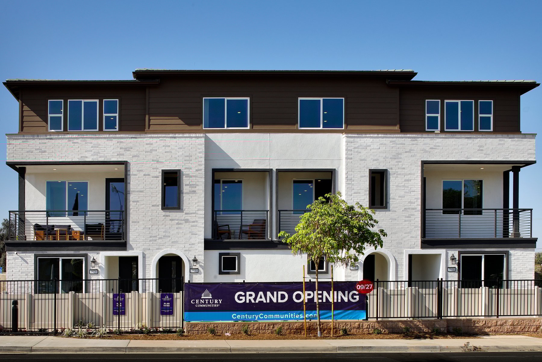 A building with a sign in front.