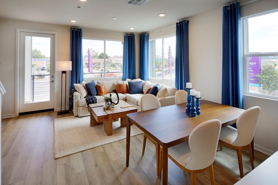 A living room with a couch and chairs.