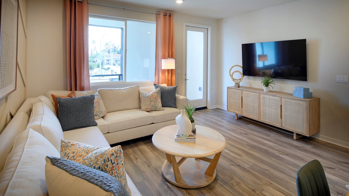 A living room with a tv and couches.