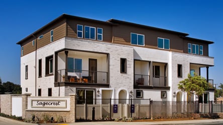 A large building with a fence in front of it.
