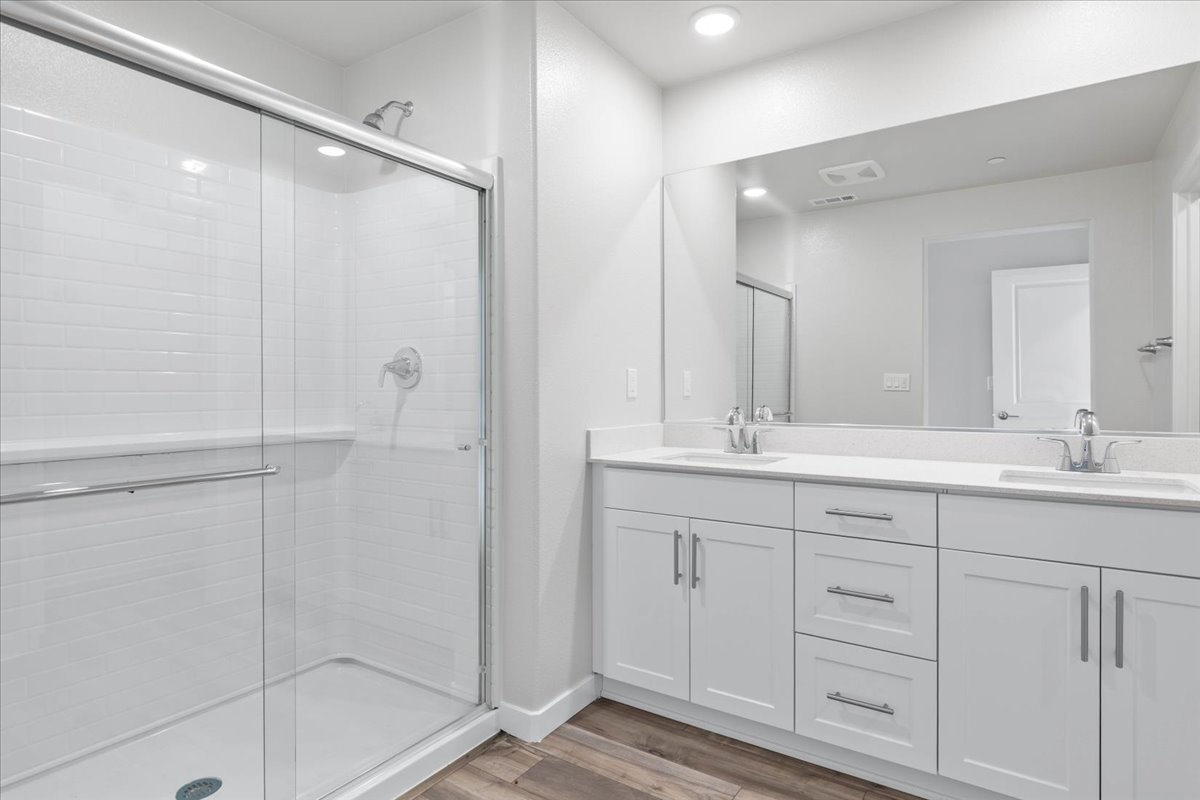A bathroom with a glass shower.