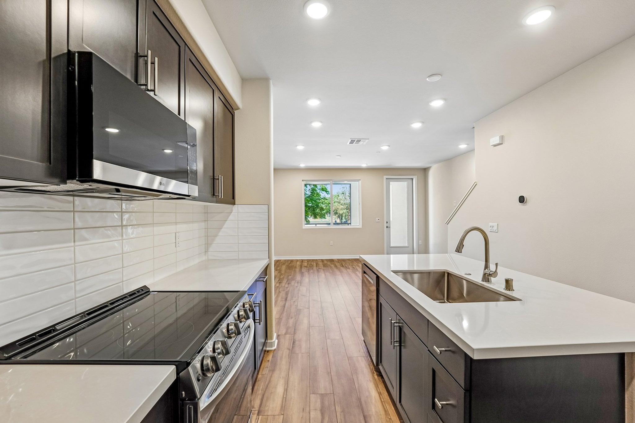 A kitchen with black appliances.
