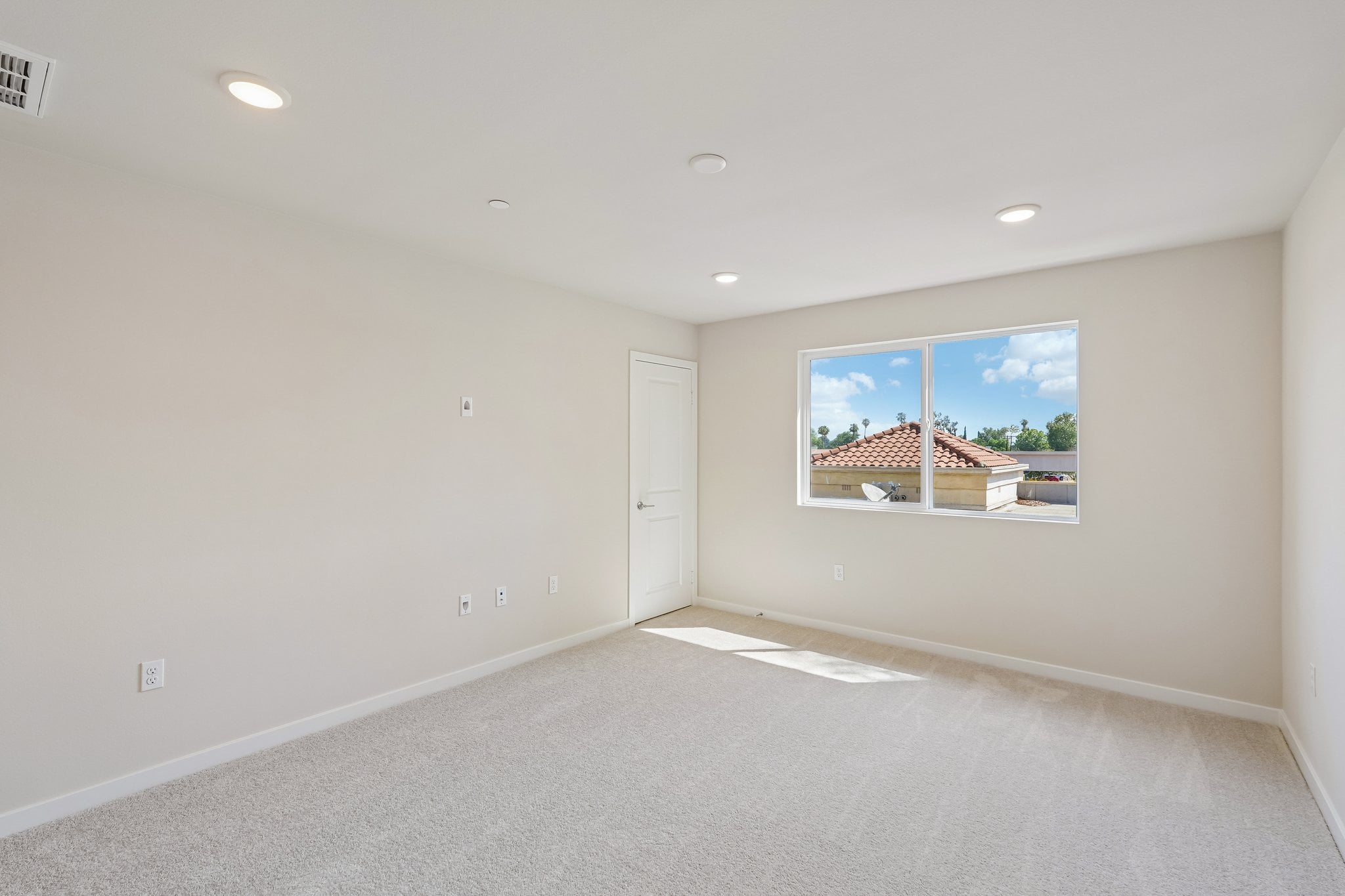 A room with a large painting on the wall.