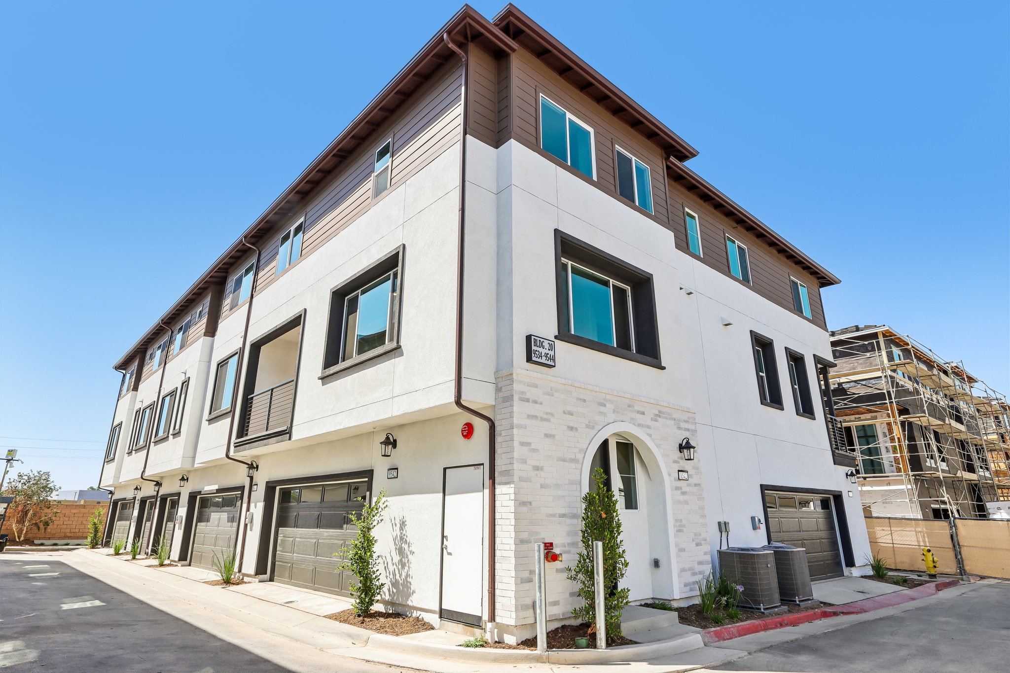 A white building with a street.
