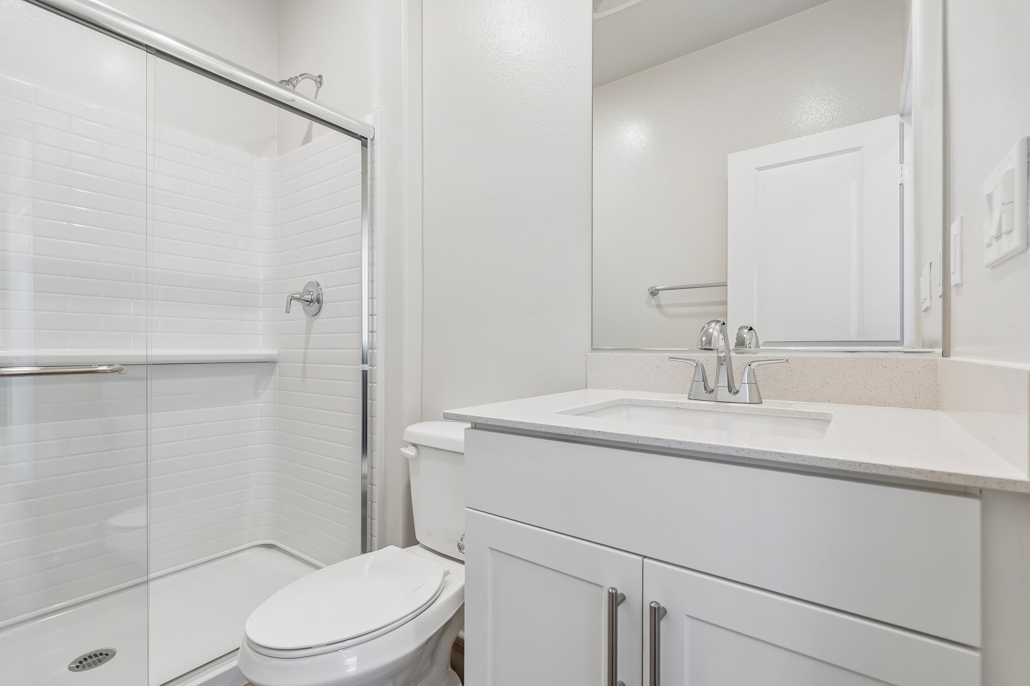 A bathroom with a glass shower.