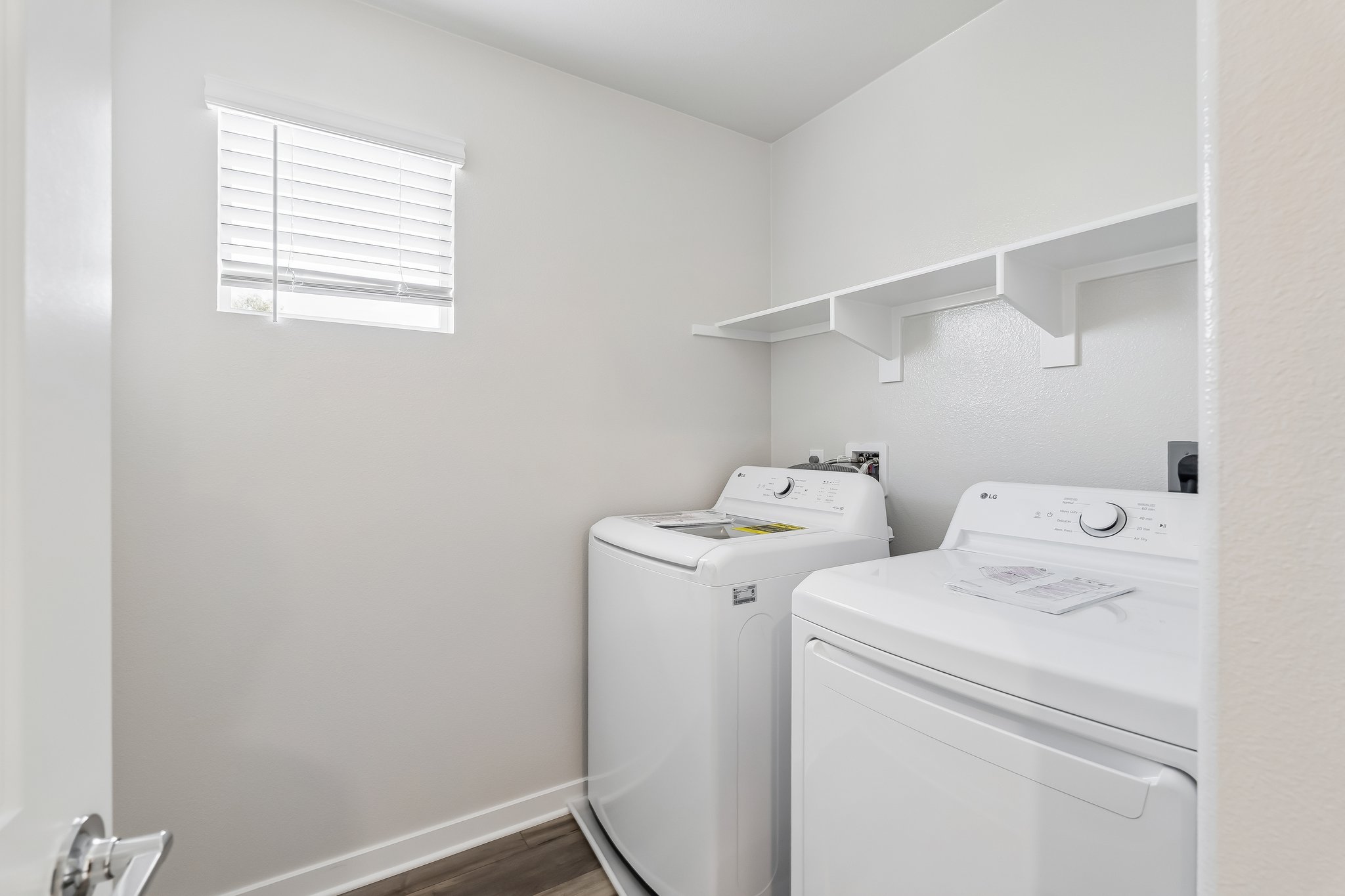 A laundry room with a washer and dryer.