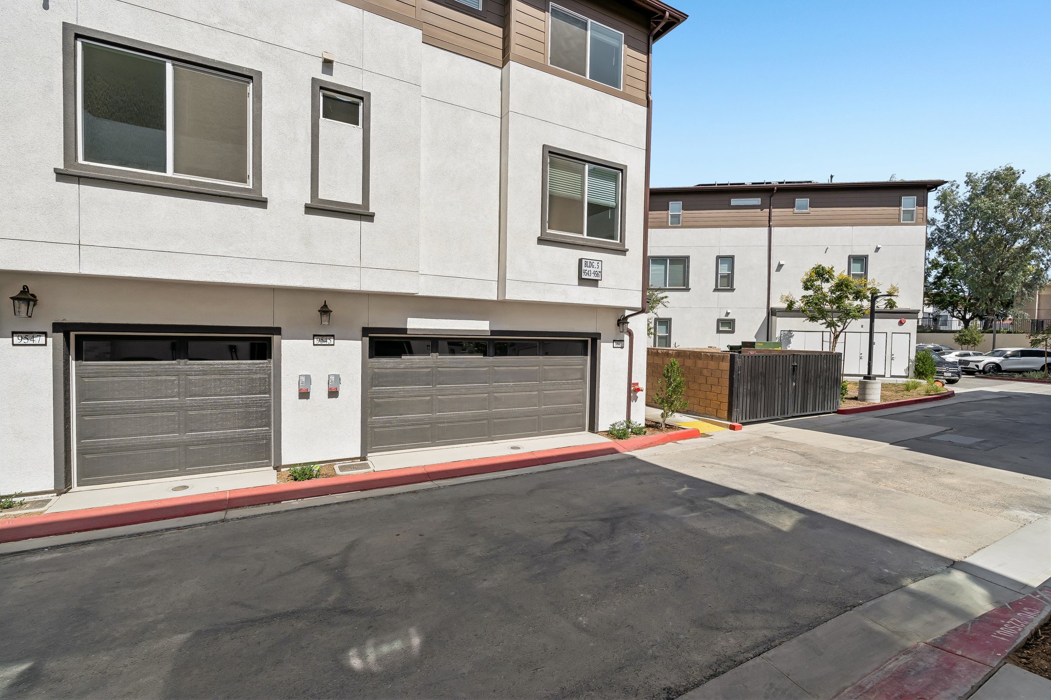 A building with garages and a street.