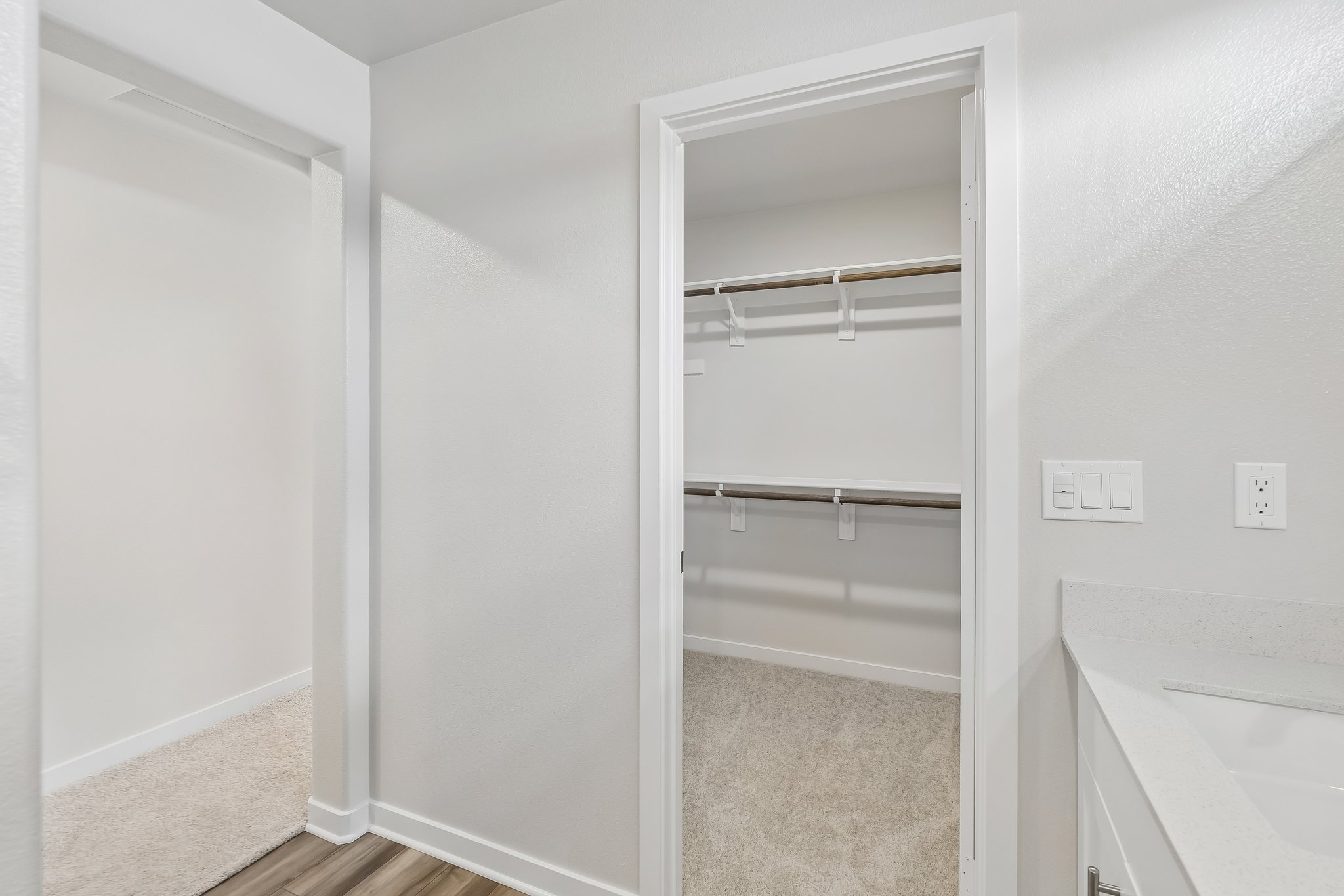 A white bathroom with a white shower.
