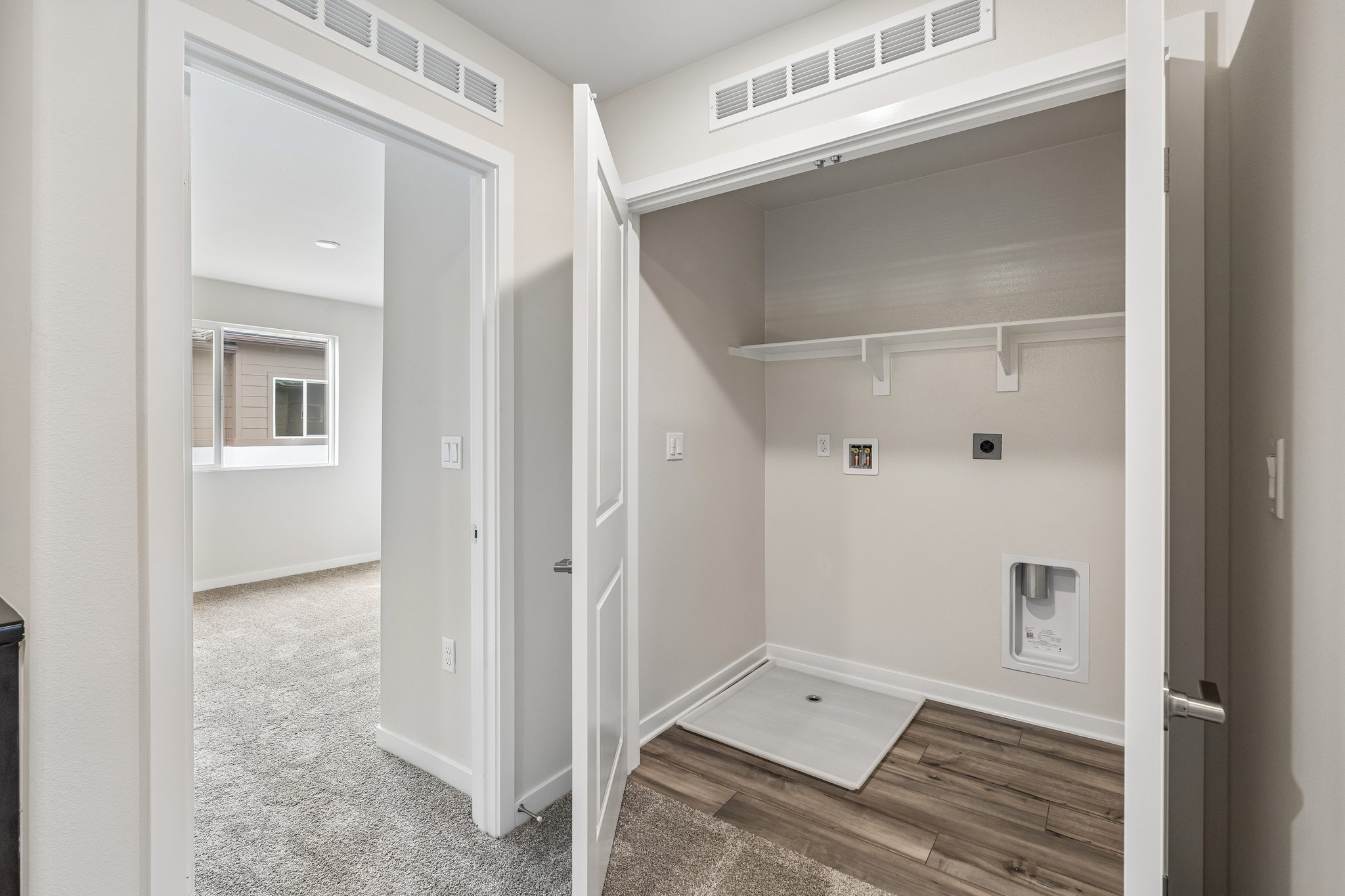 A hallway with white doors.