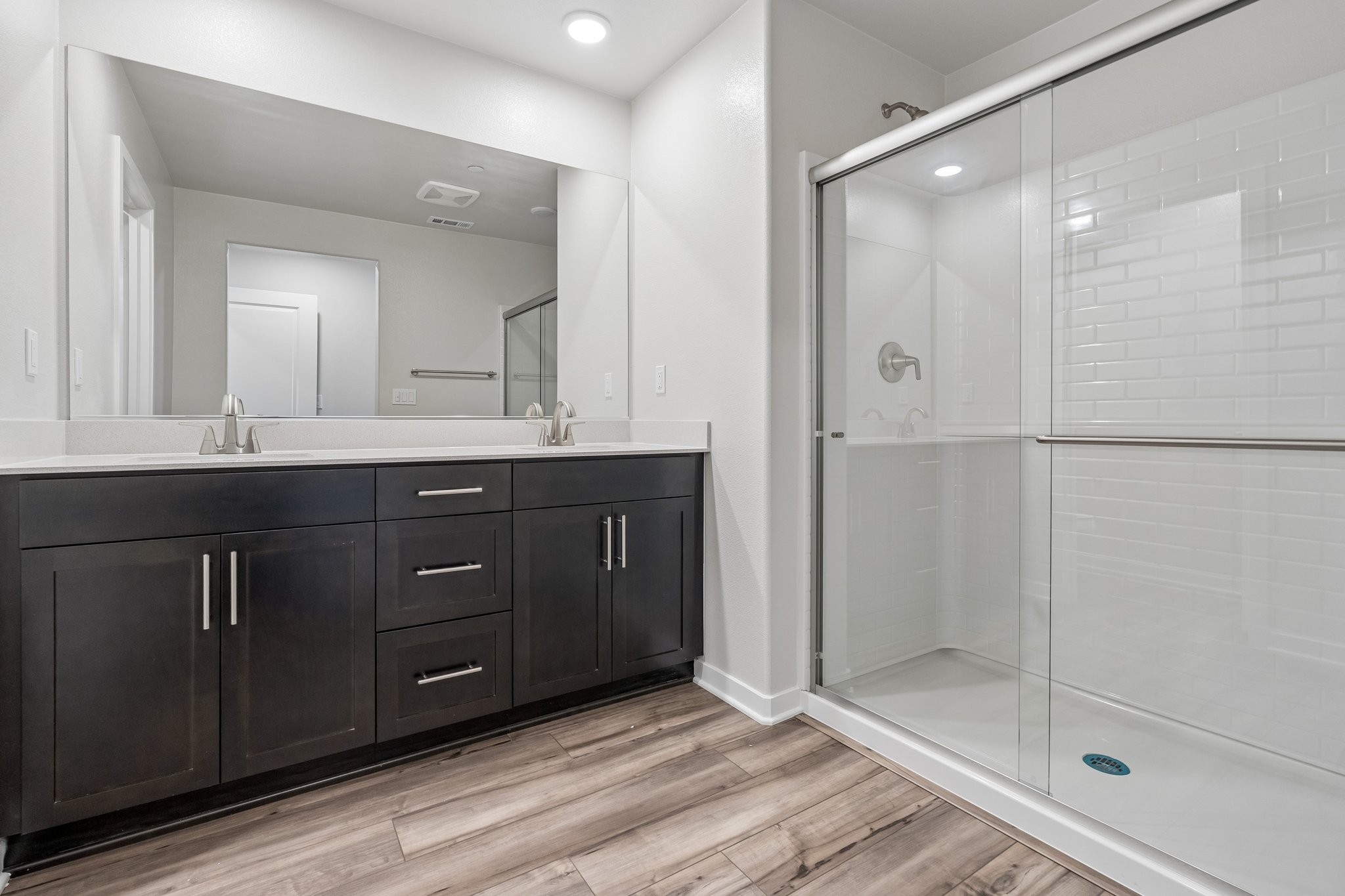 A bathroom with a glass shower.