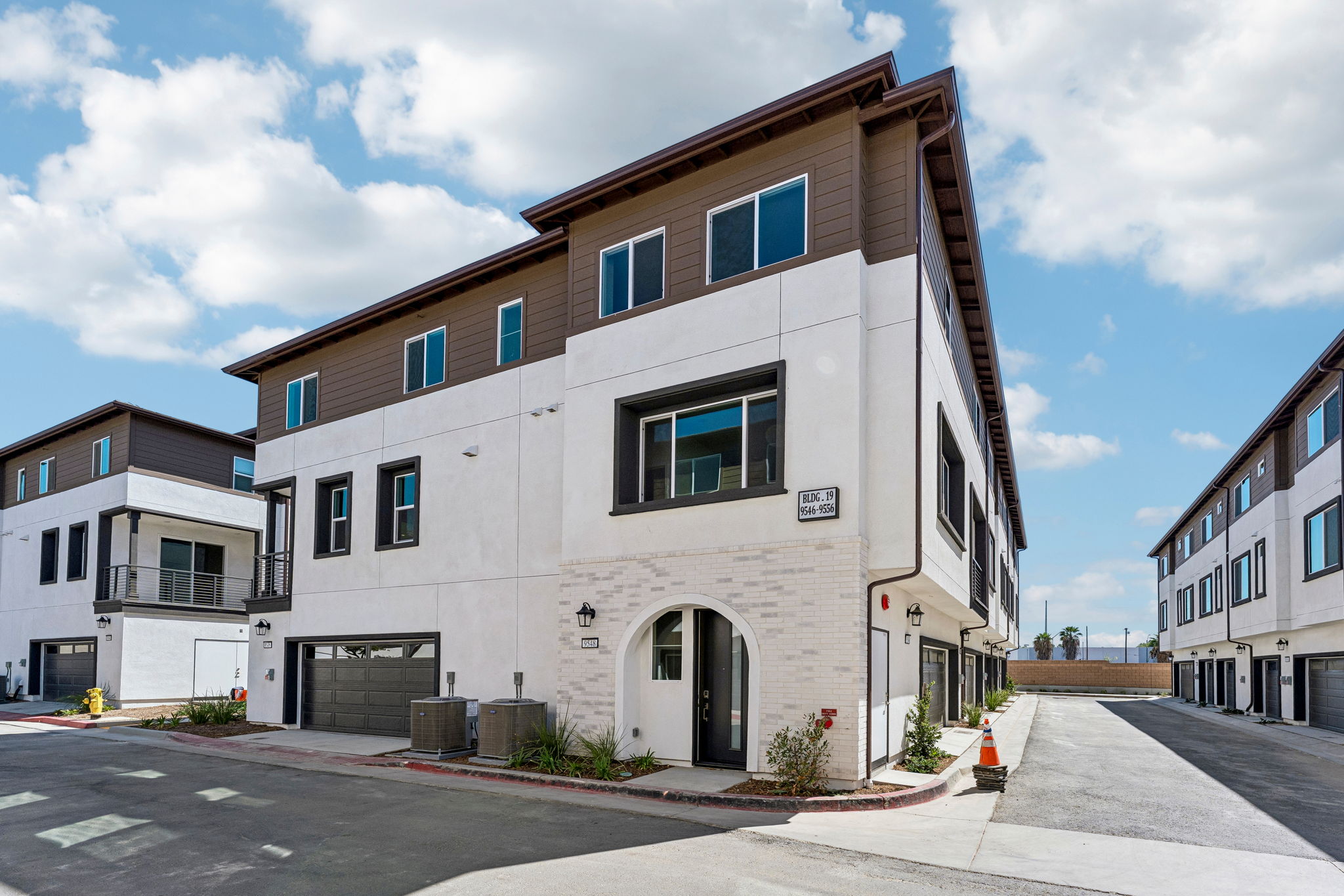 A white building with a blue sky.