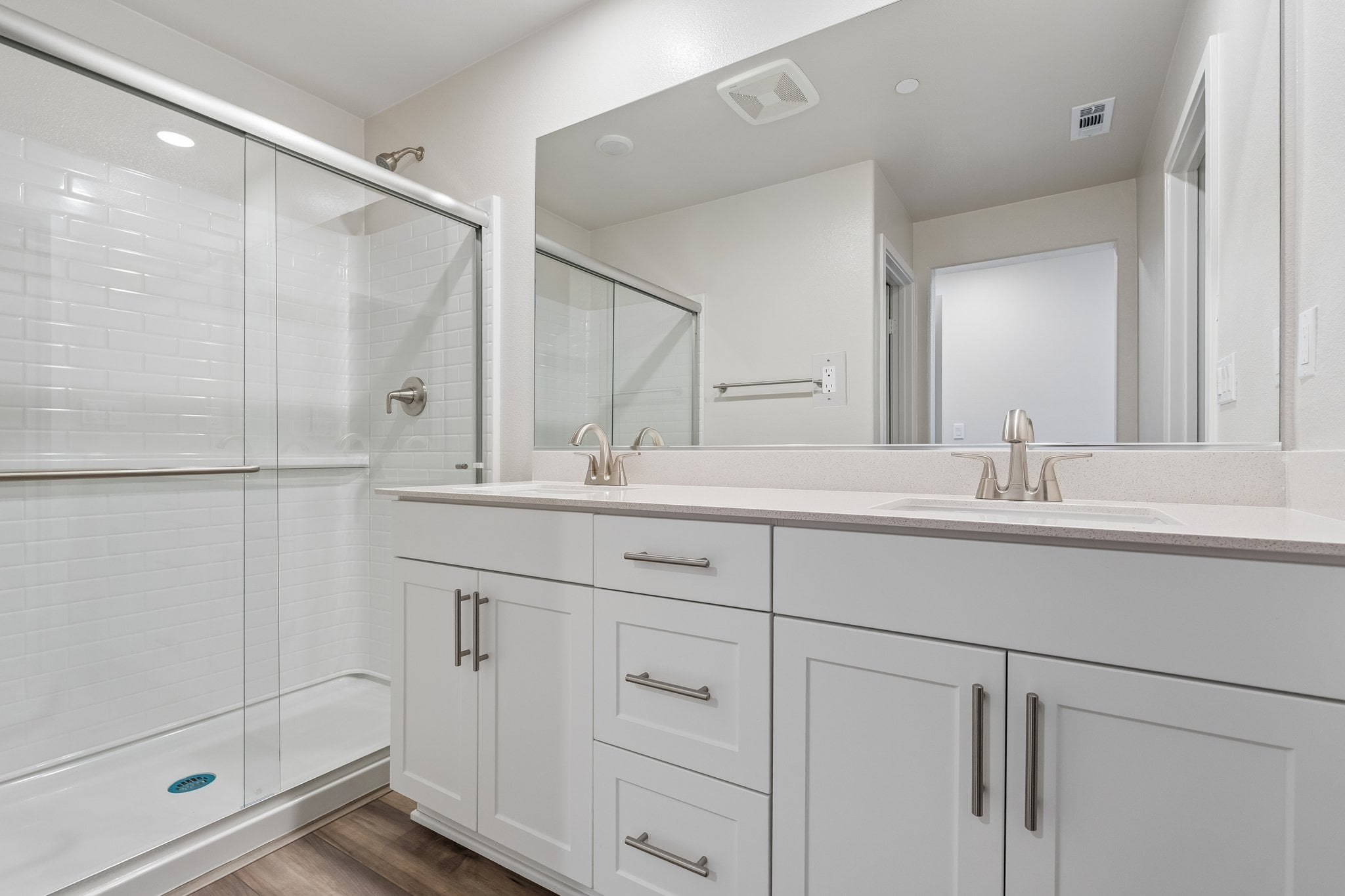 A bathroom with a glass shower.