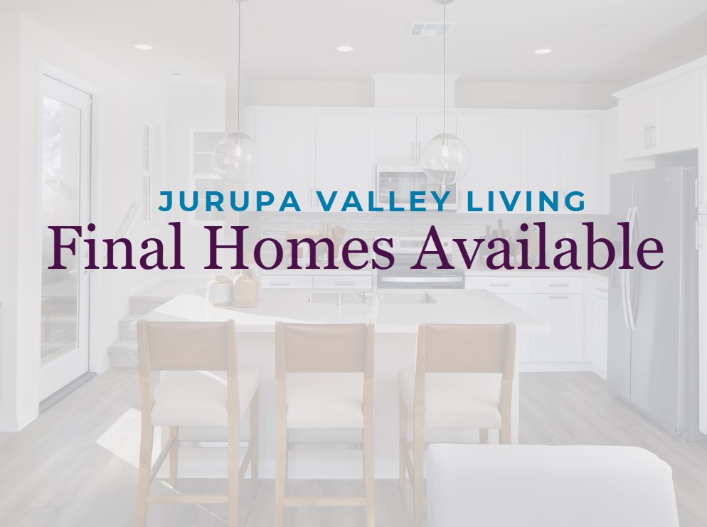 A dining room with a table and chairs.