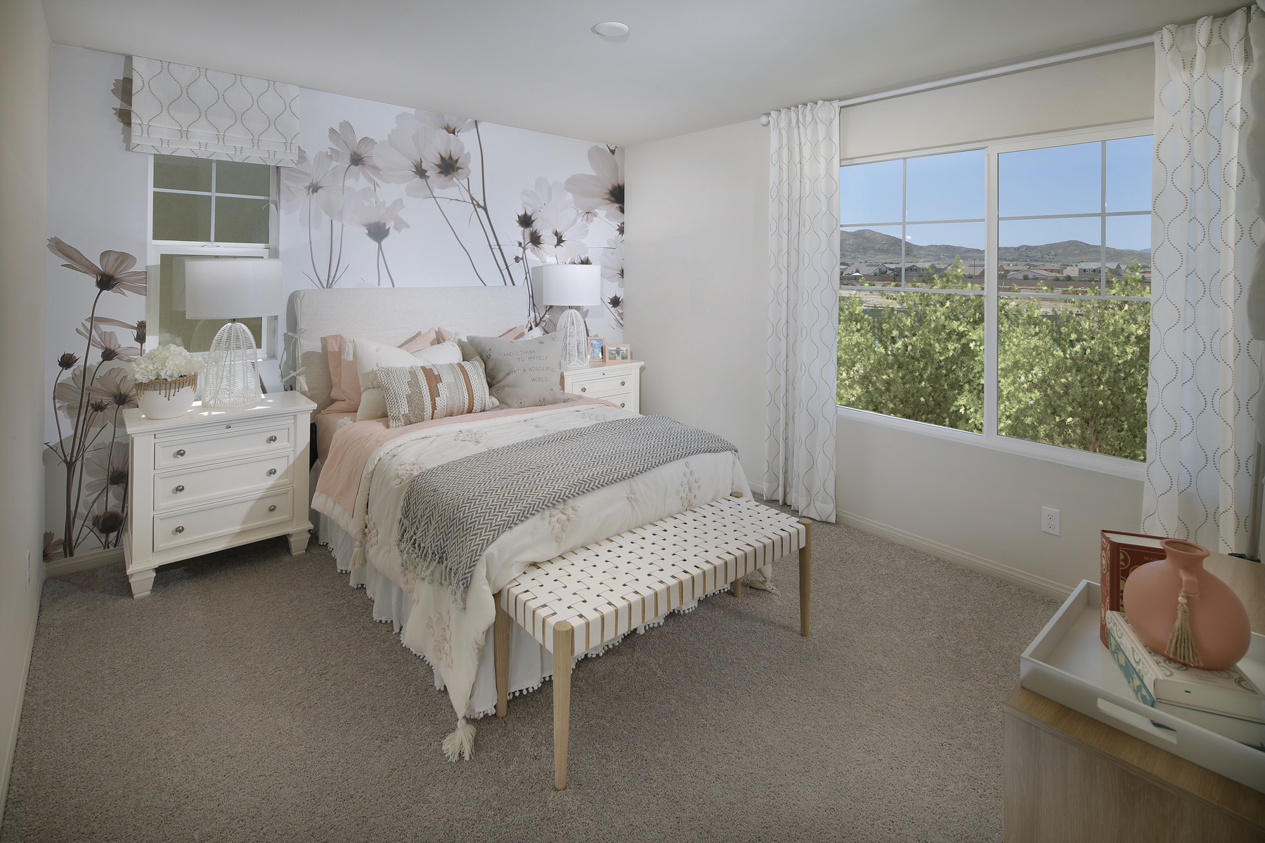 A bedroom with a bed and a window.