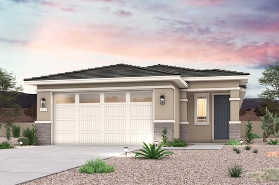 A house with a gravel driveway.