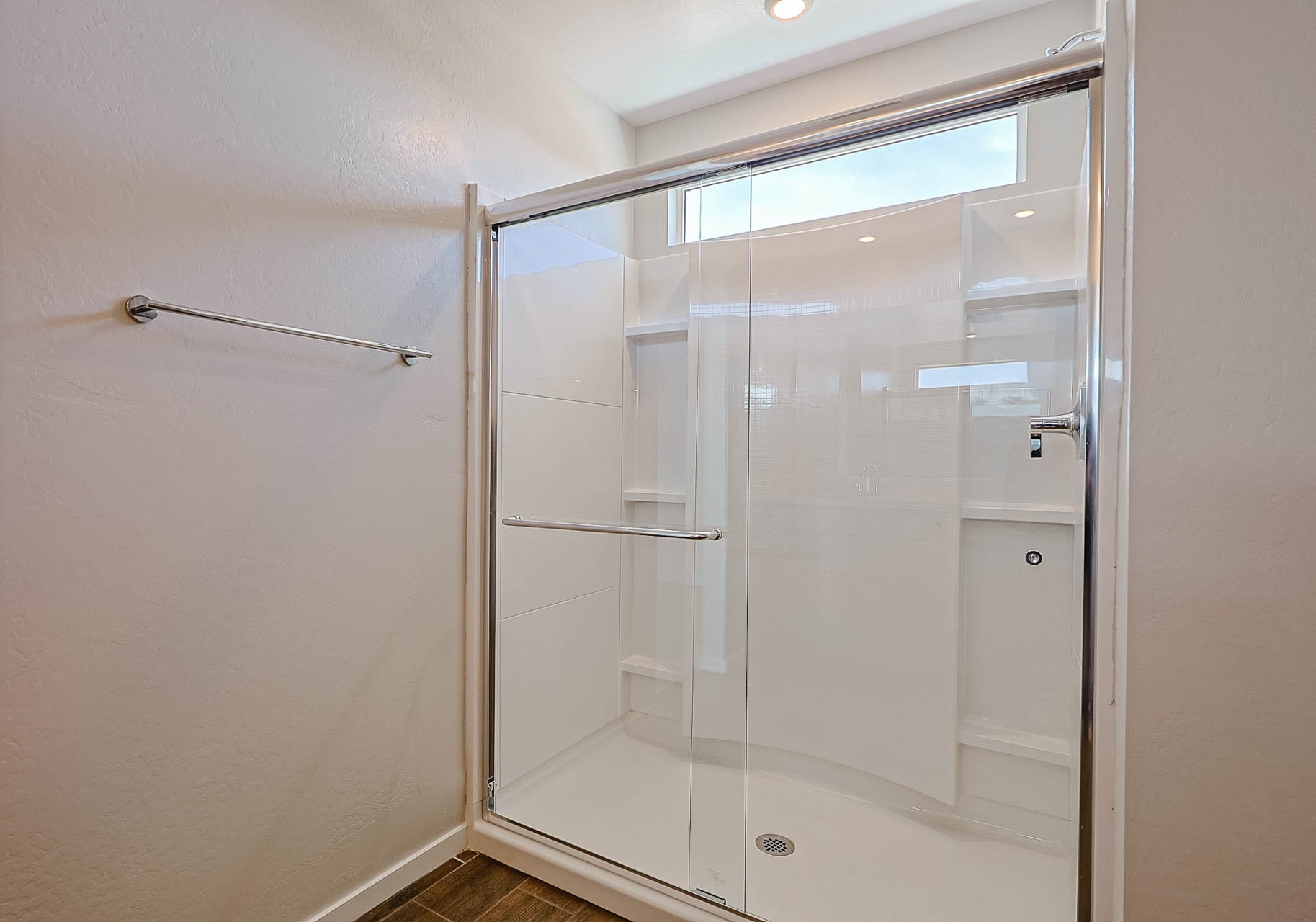 A shower unit in a bathroom.