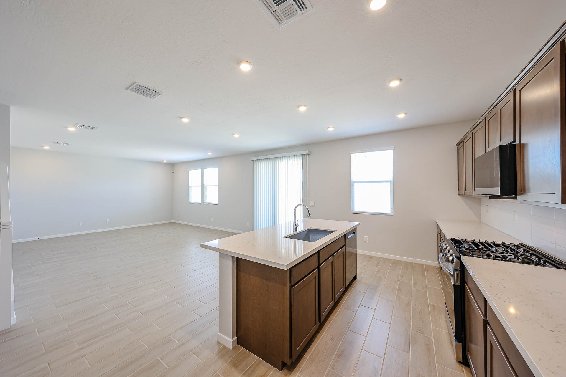 A kitchen with a wood floor.