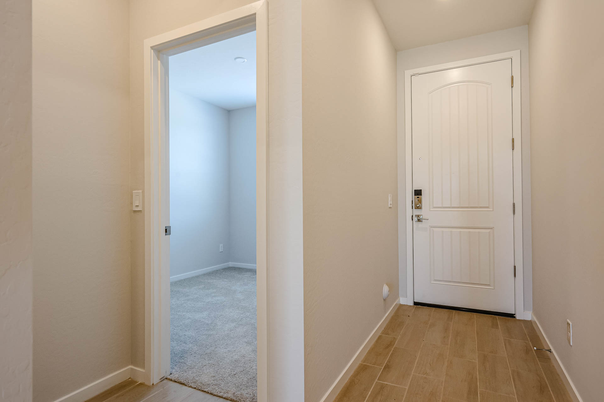 A hallway with white doors.