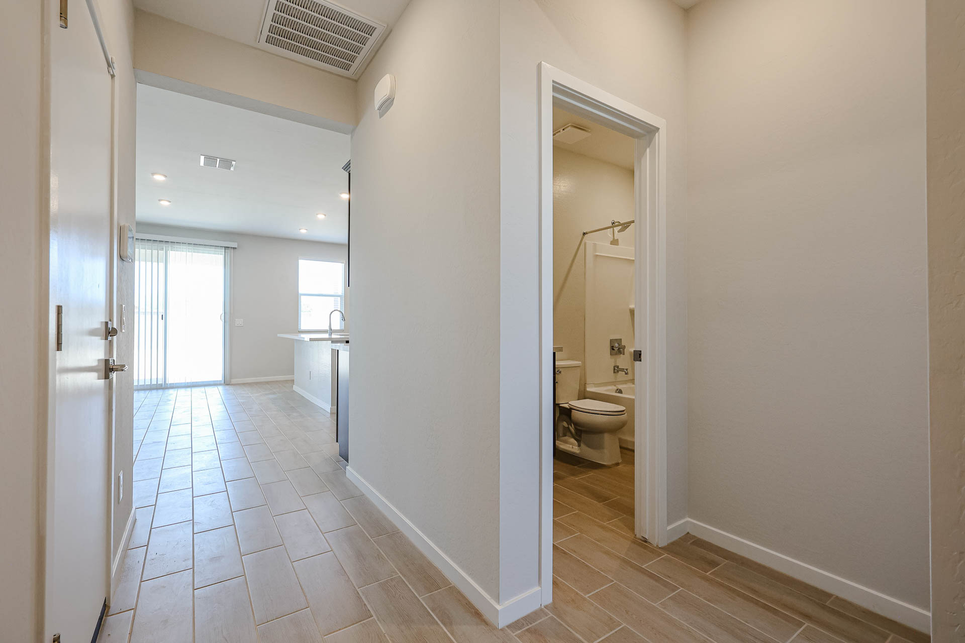 A bathroom with a toilet and a sink.