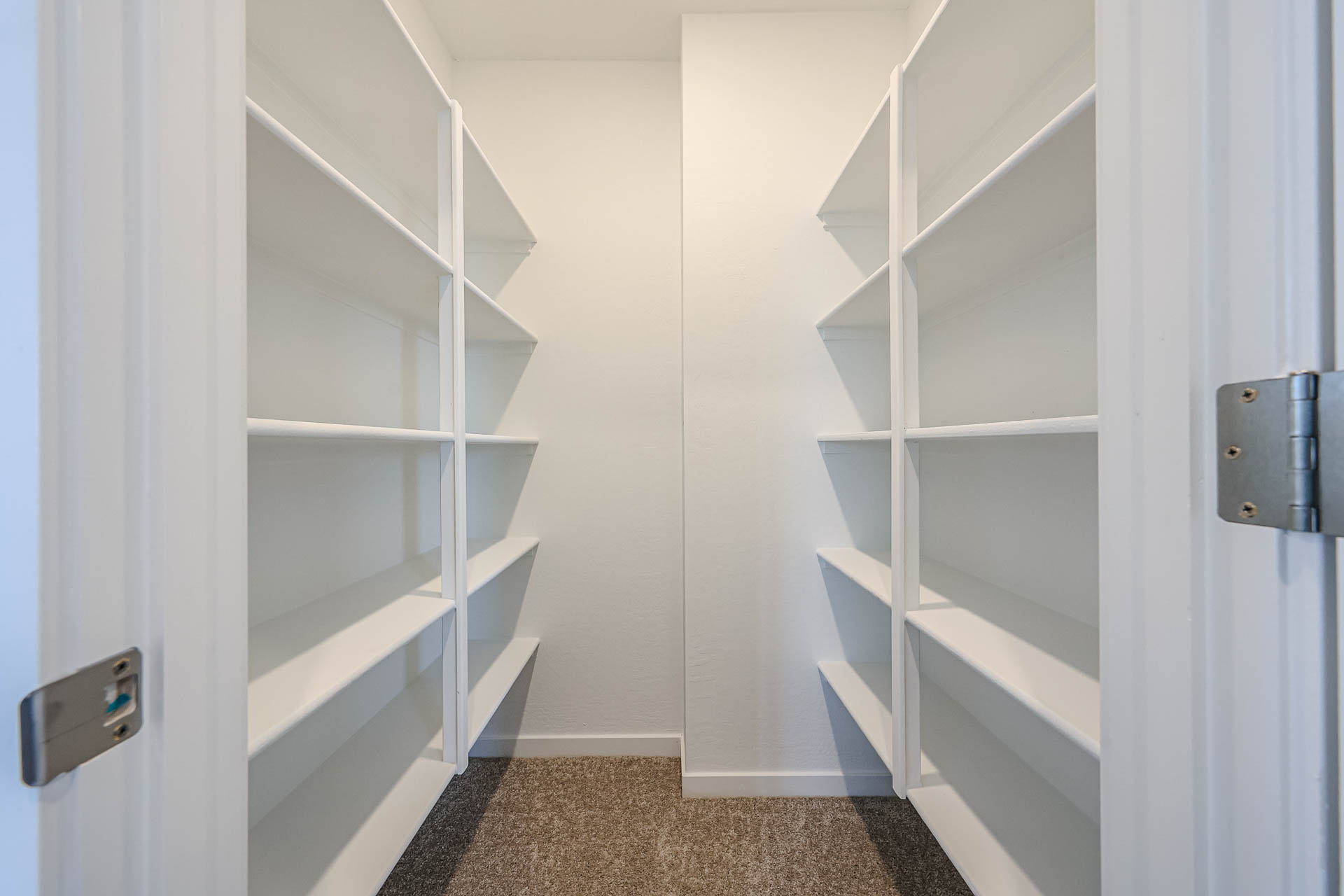 A white staircase with a door.