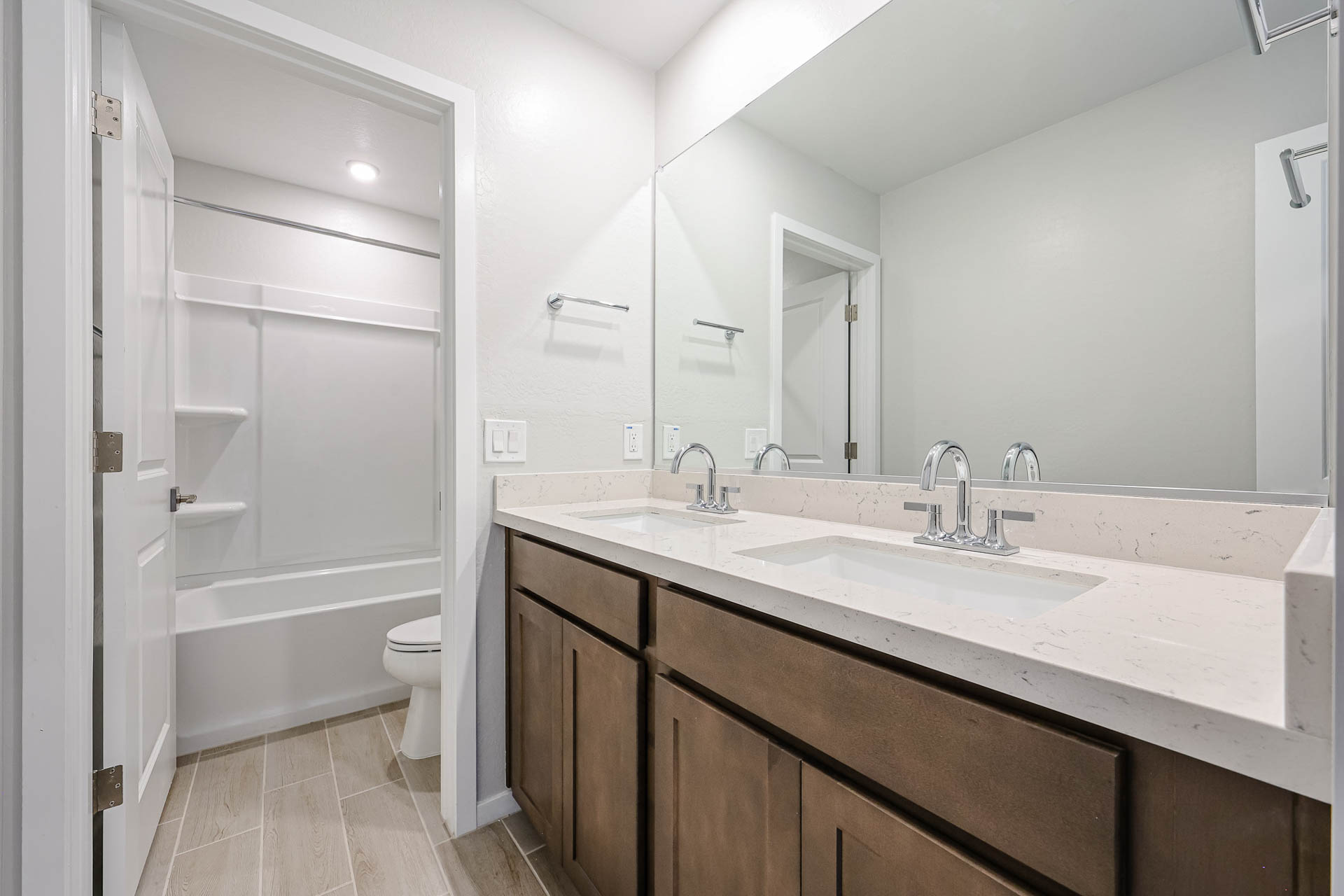A bathroom with a sink and a shower.