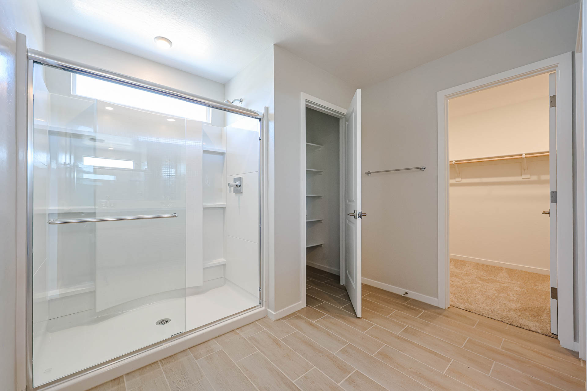 A bathroom with a glass shower.