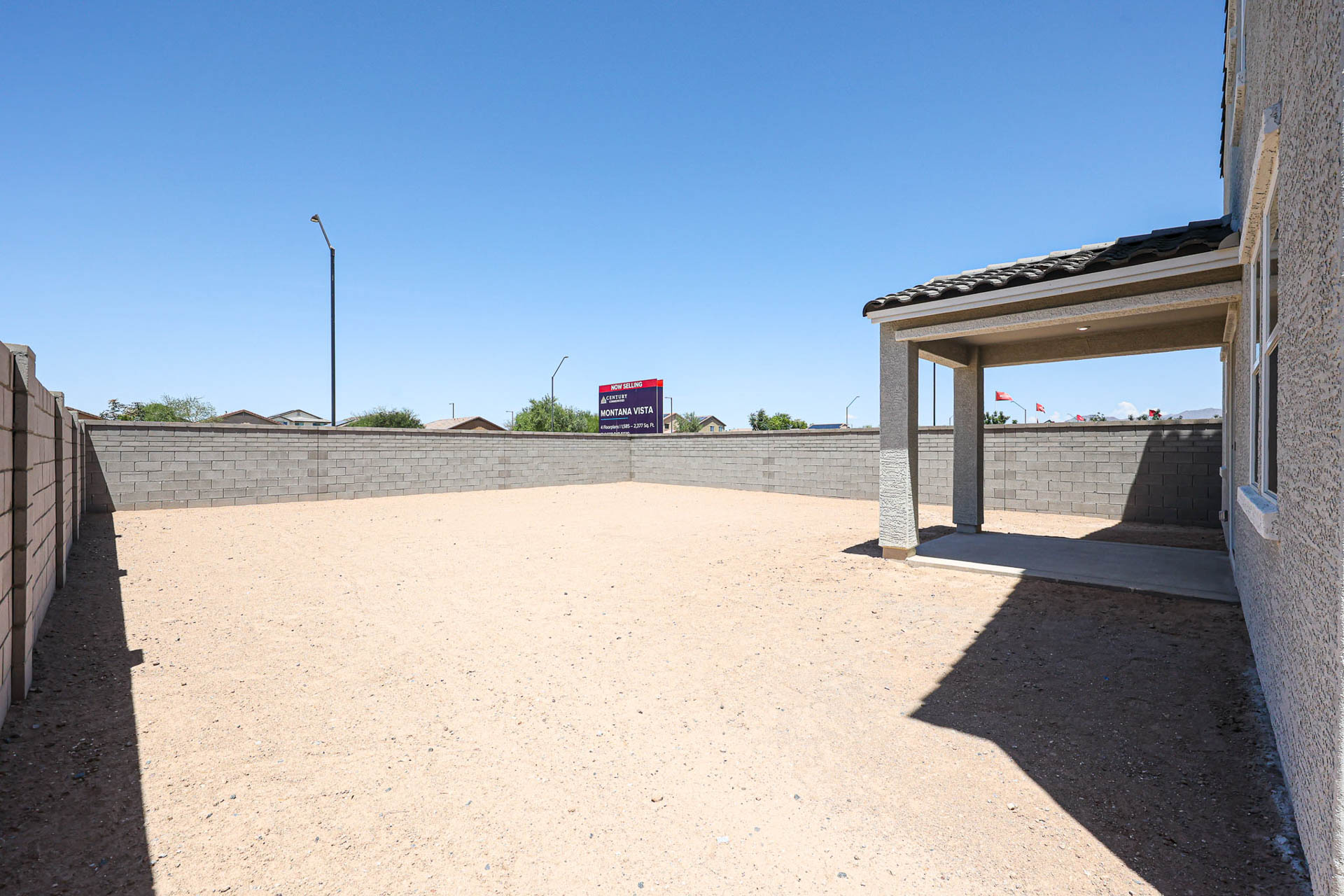 A concrete area with a sign.