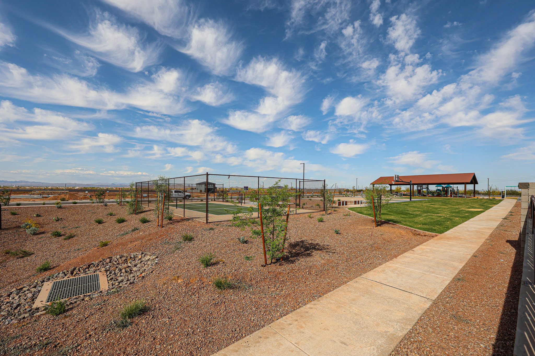 A garden with a fence and a path.