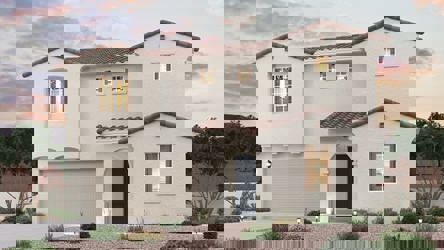 A white house with a driveway.