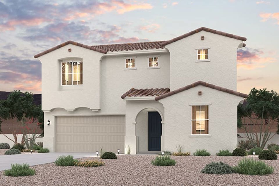 A white house with a driveway.