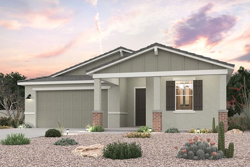 A house with a gravel driveway.