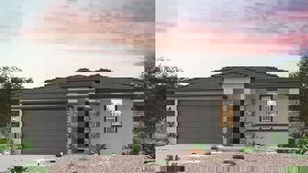 A house with a gravel driveway.