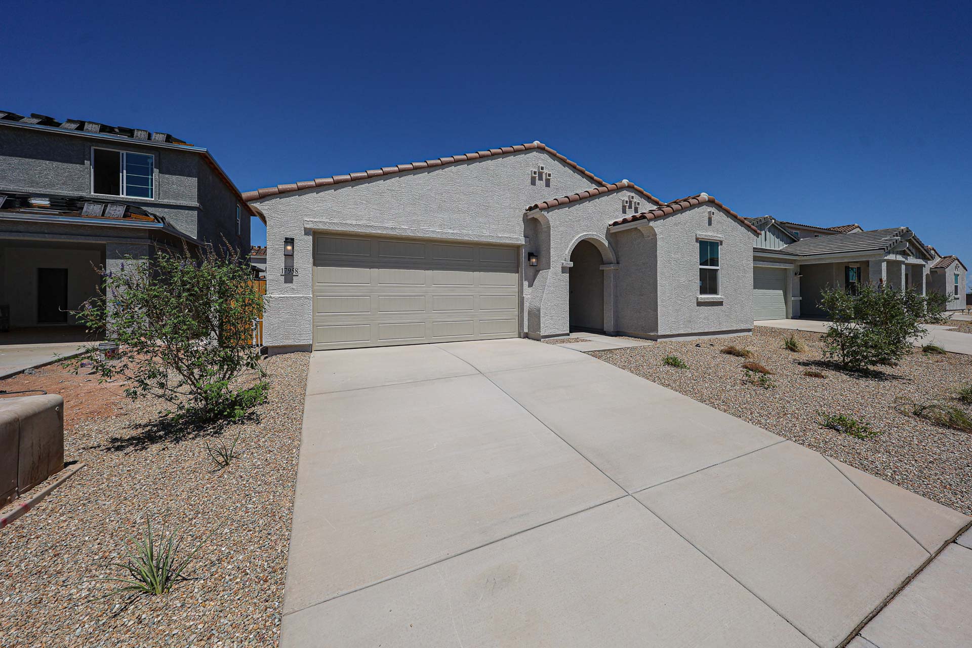 A driveway leading to a house.