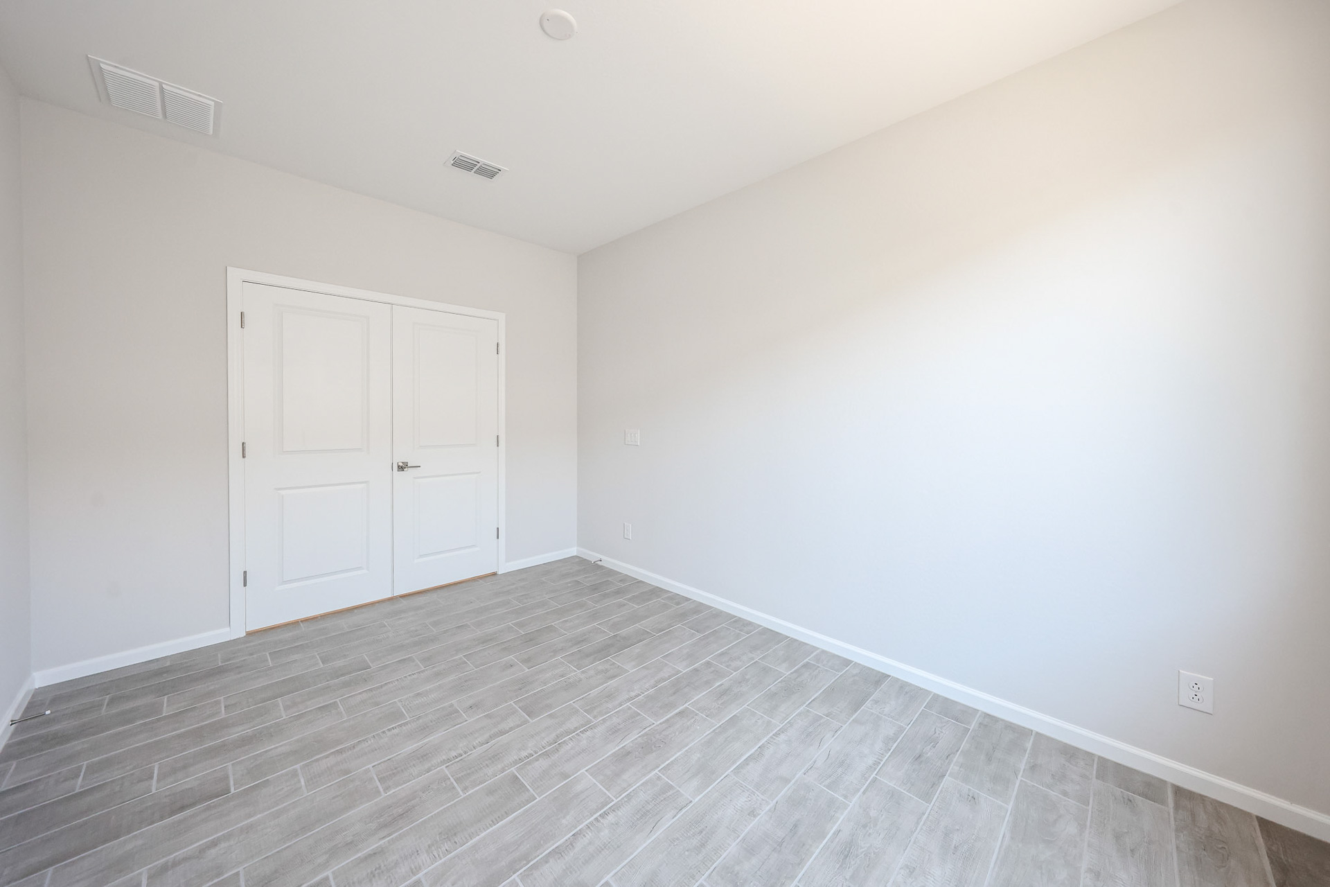 A room with white doors.