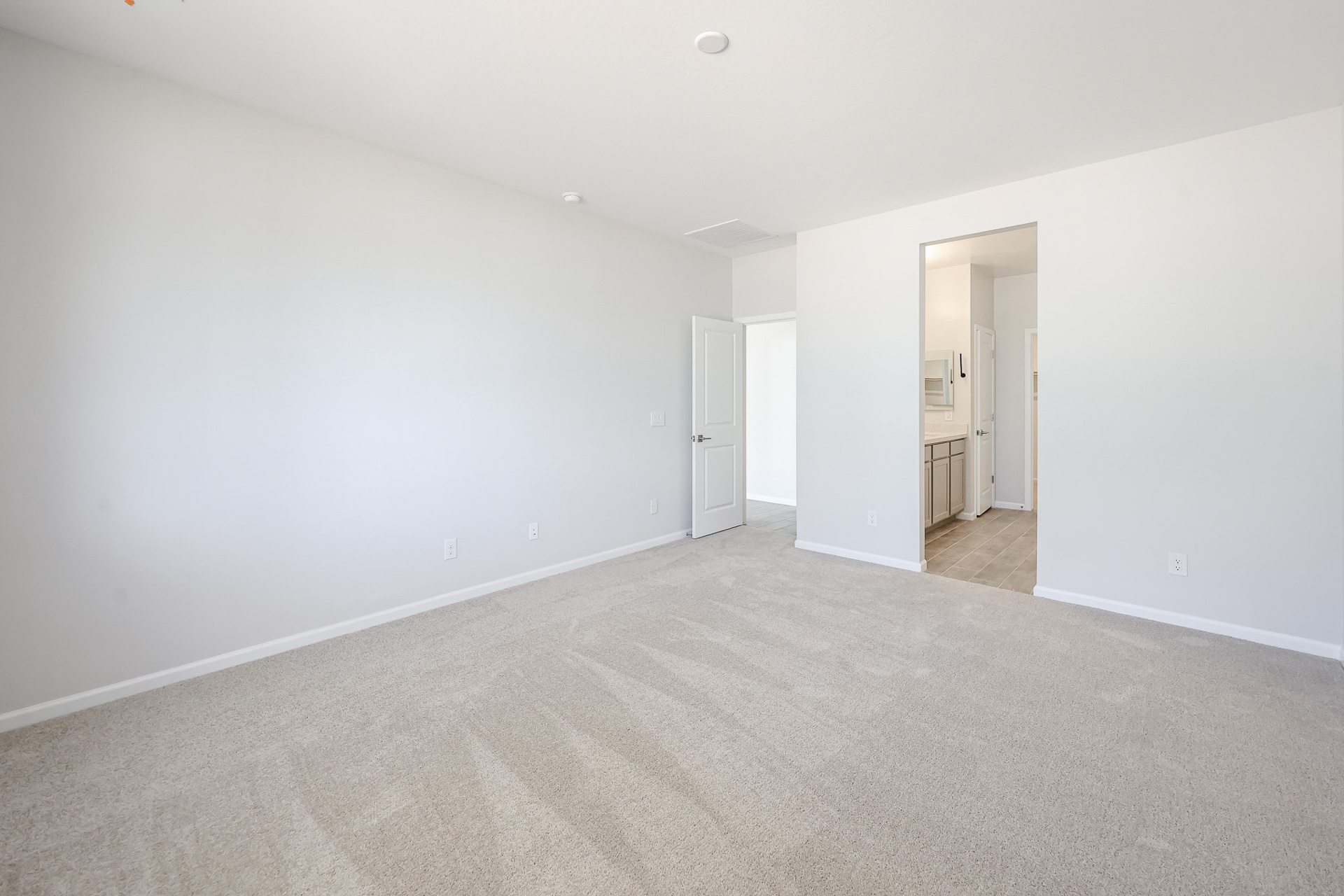 A long hallway with white walls.