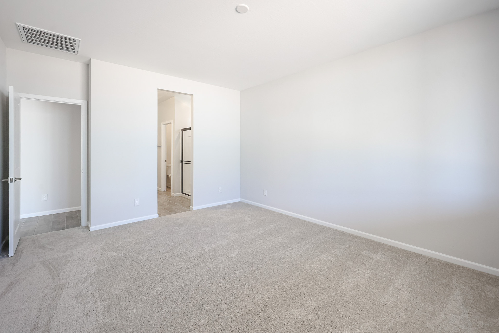 A hallway with white walls.