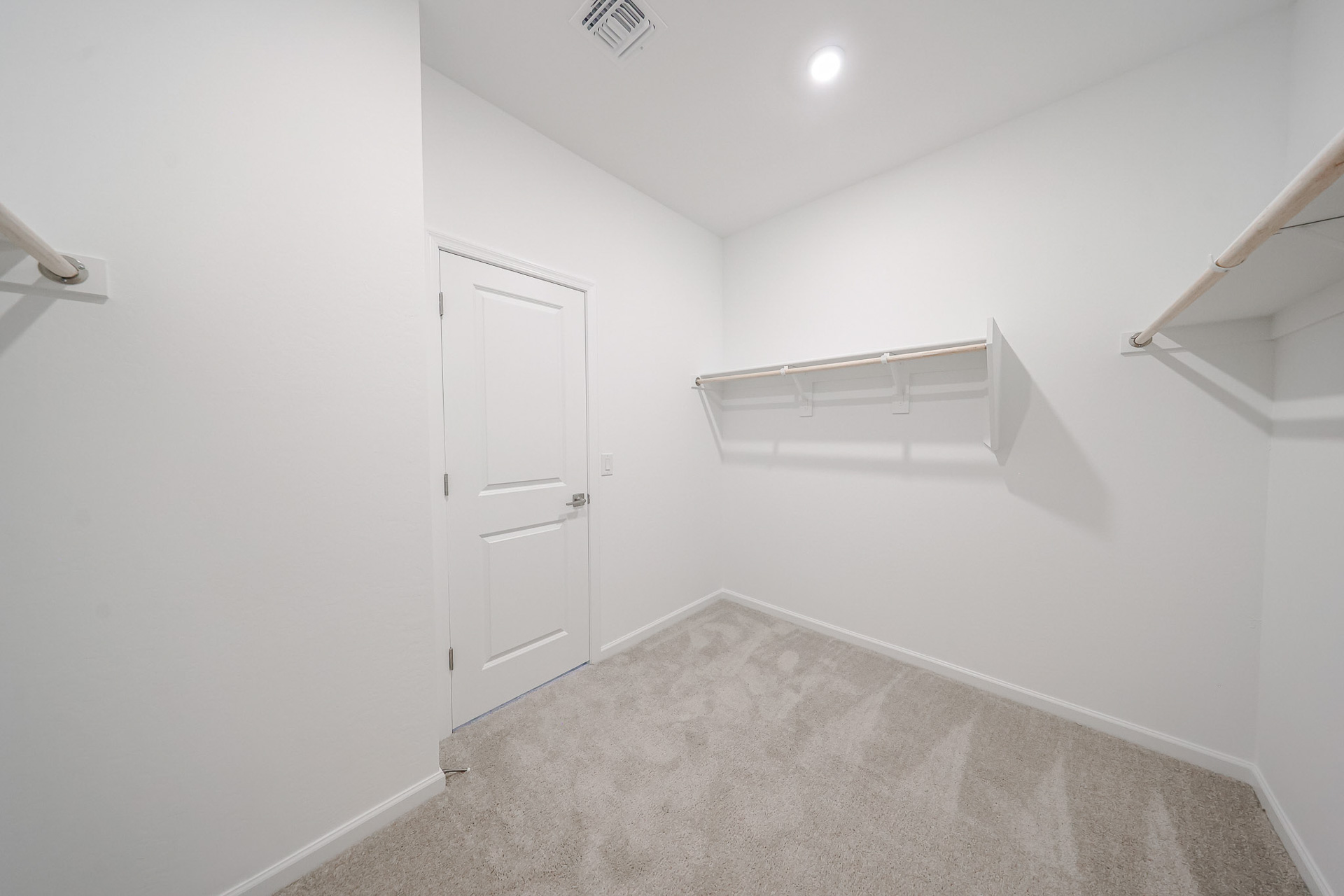 A hallway with white walls.