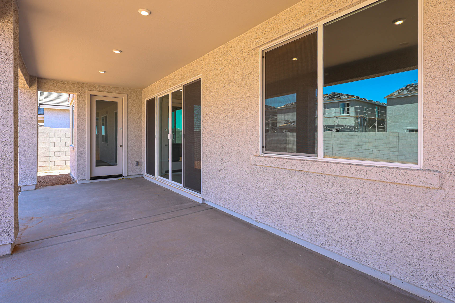 A room with windows and a walkway.