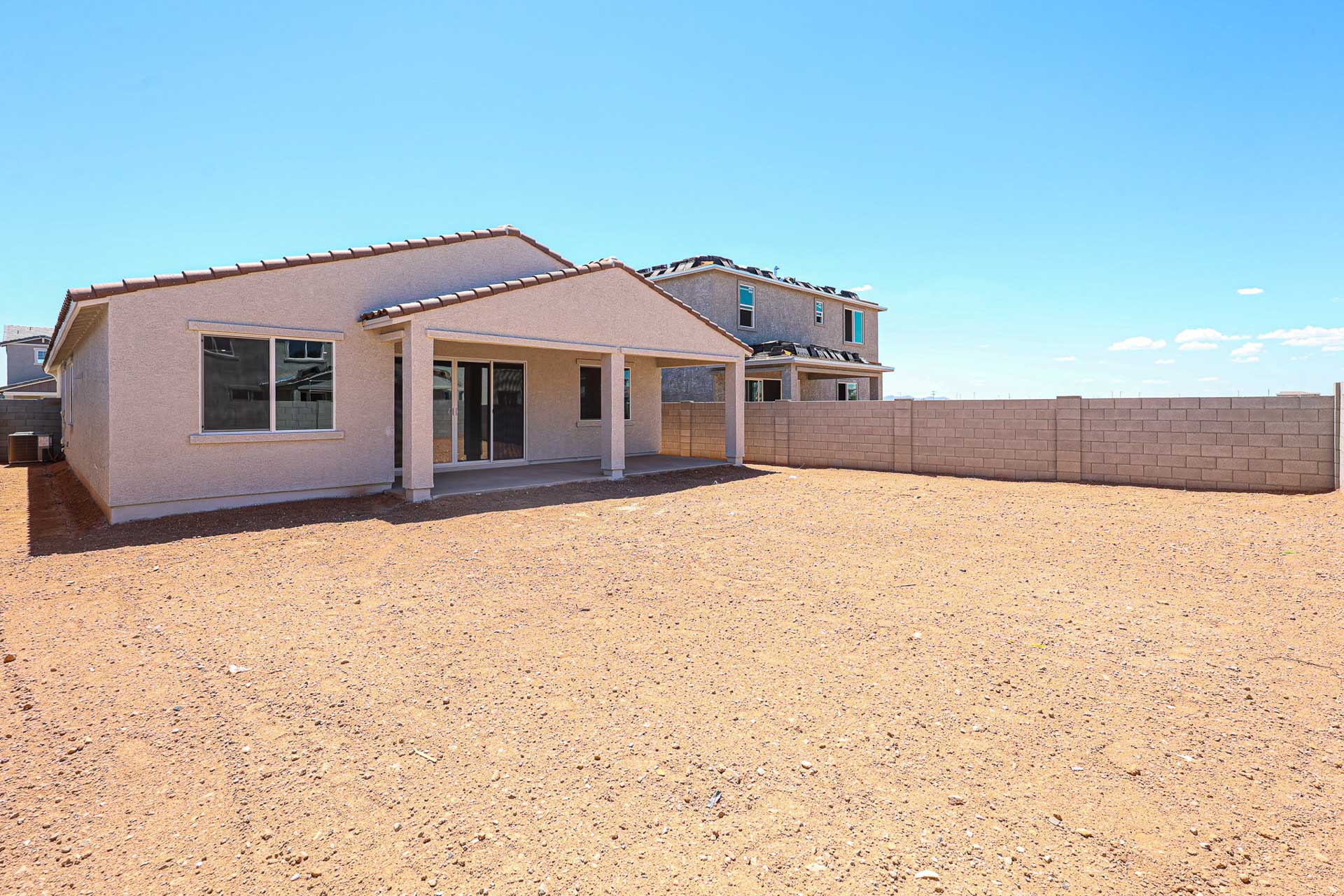 A house with a dirt yard.