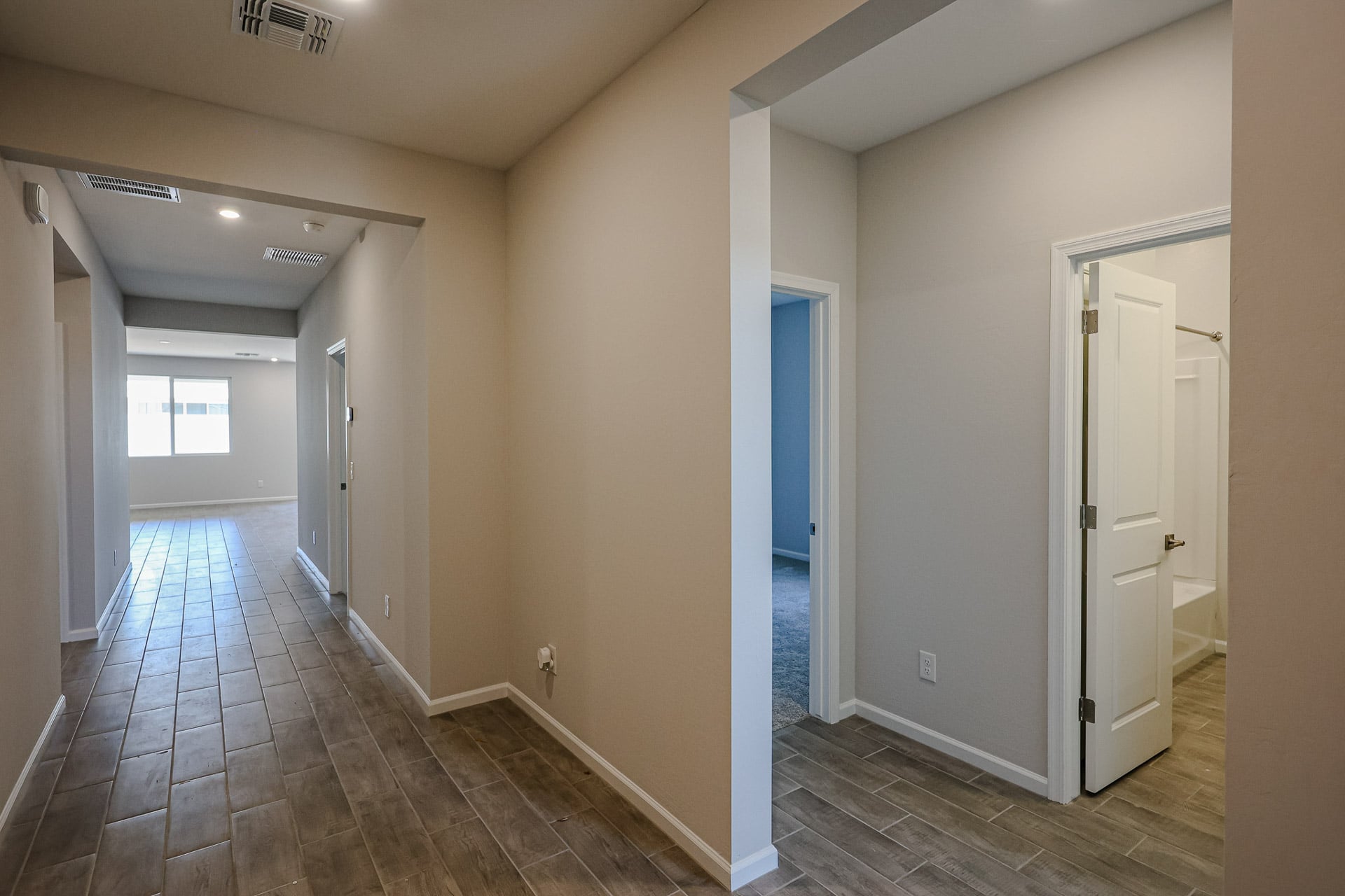 A hallway with white walls.